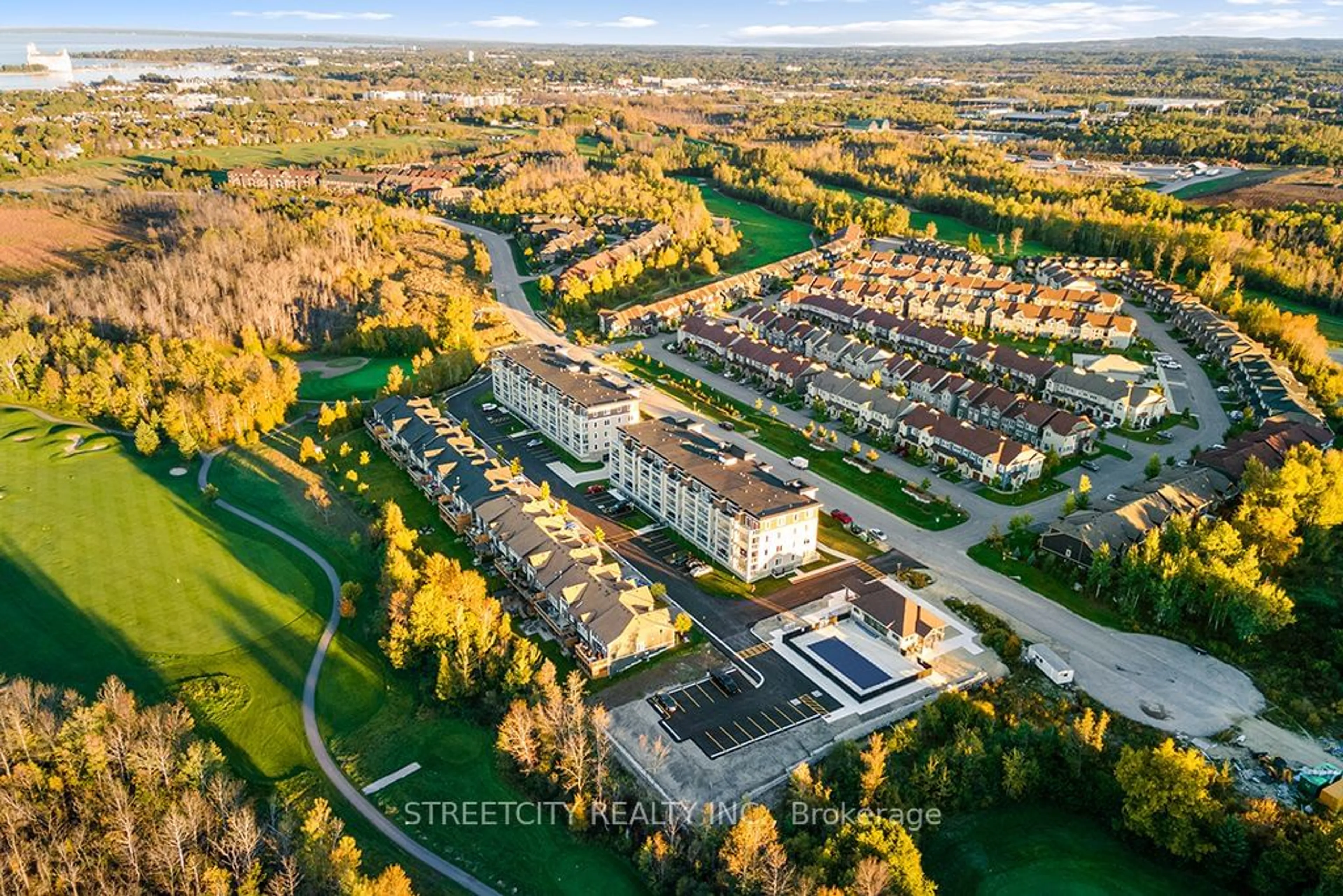 A pic from outside/outdoor area/front of a property/back of a property/a pic from drone, street for 5 Spooner Cres #215, Collingwood Ontario L9Y 1T3