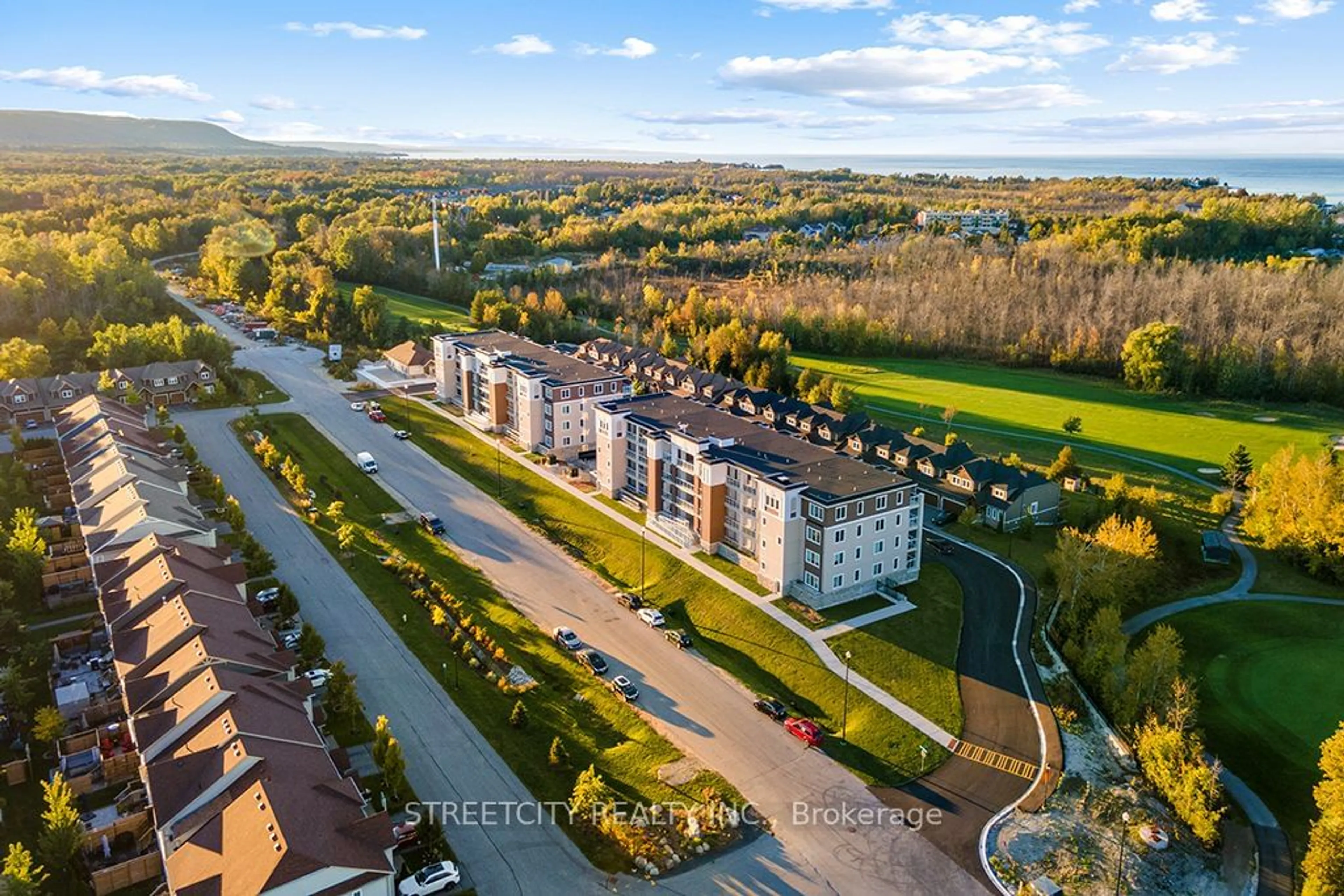 A pic from outside/outdoor area/front of a property/back of a property/a pic from drone, unknown for 5 Spooner Cres #215, Collingwood Ontario L9Y 1T3