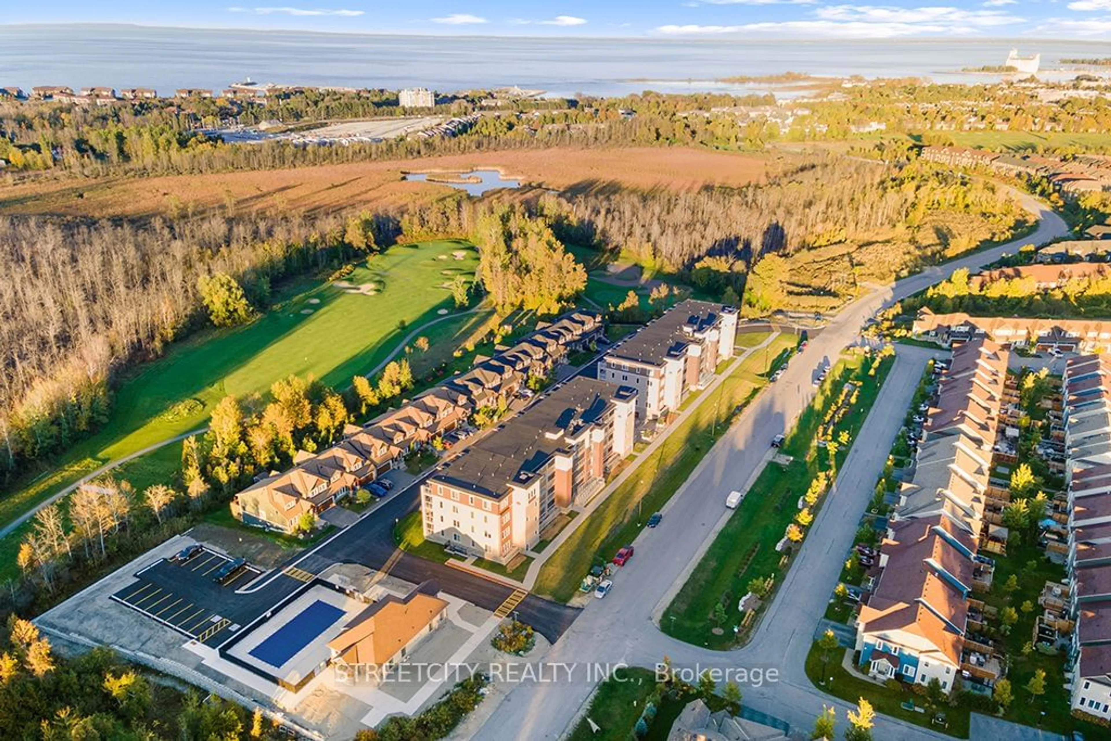 A pic from outside/outdoor area/front of a property/back of a property/a pic from drone, street for 5 Spooner Cres #215, Collingwood Ontario L9Y 1T3