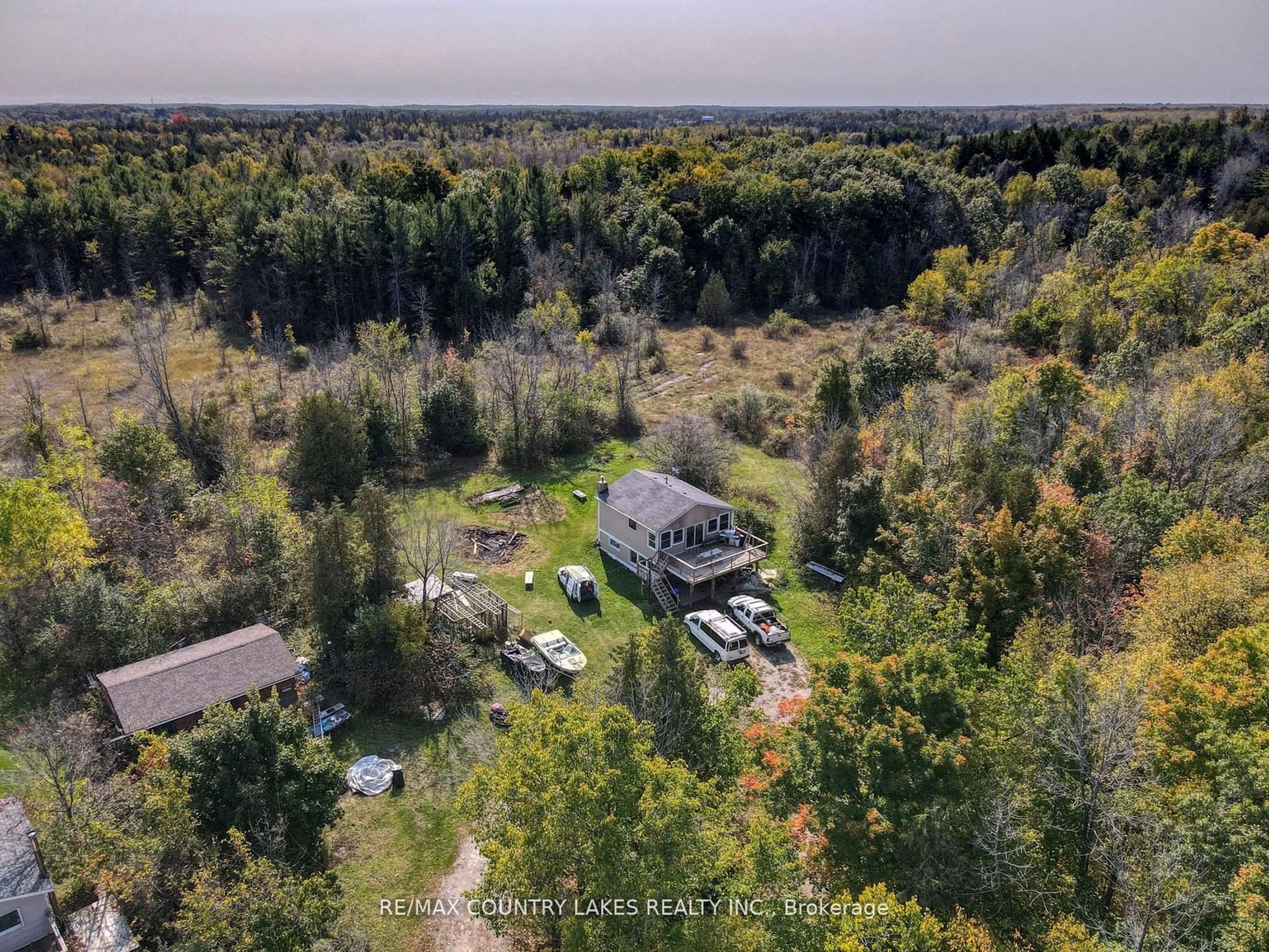 A pic from outside/outdoor area/front of a property/back of a property/a pic from drone, forest/trees view for 1157 Sylvan Glen Rd, Ramara Ontario L0K 1B0