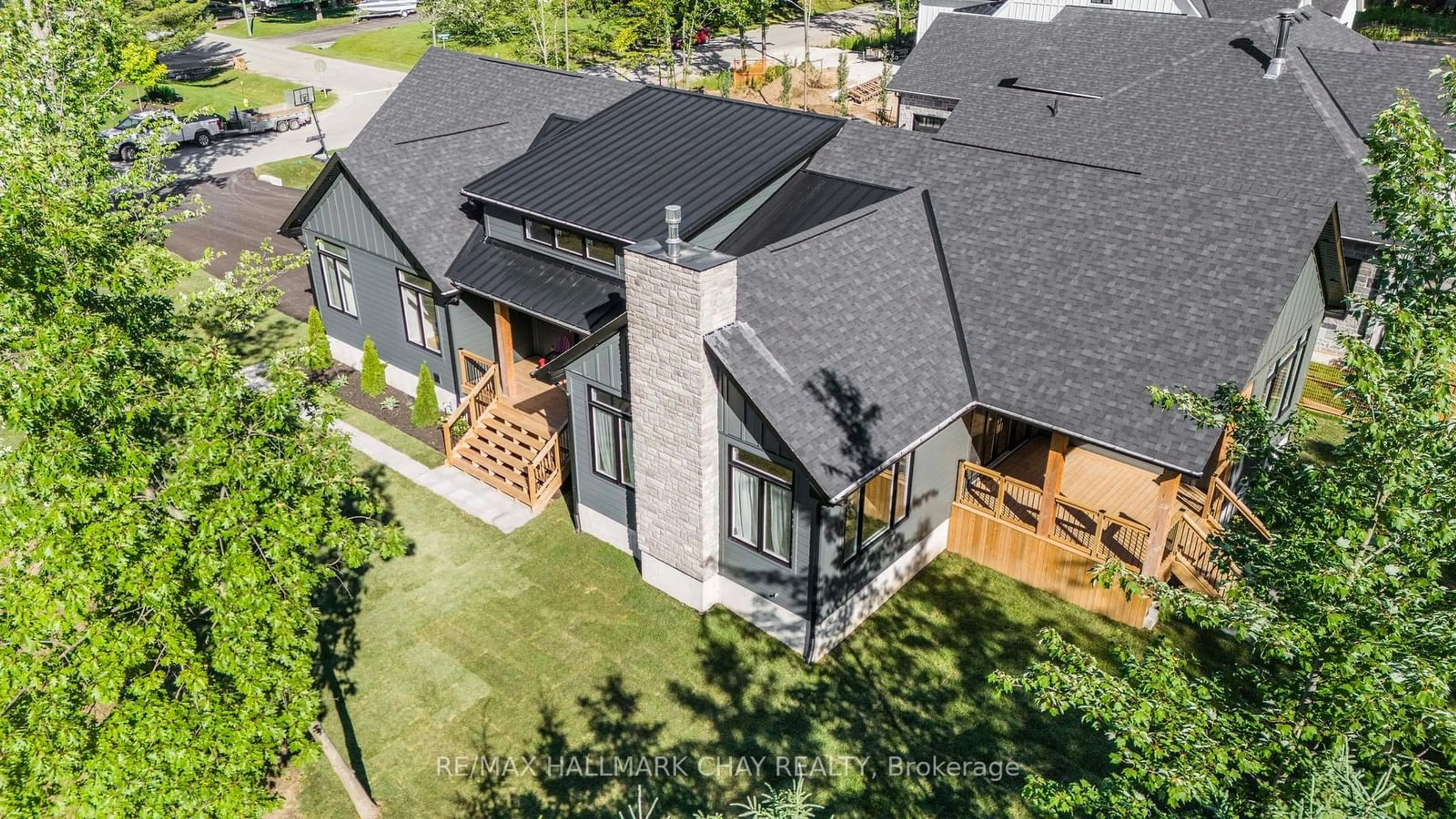 A pic from outside/outdoor area/front of a property/back of a property/a pic from drone, unknown for 21 Heatherwood Dr, Springwater Ontario L0L 1X1