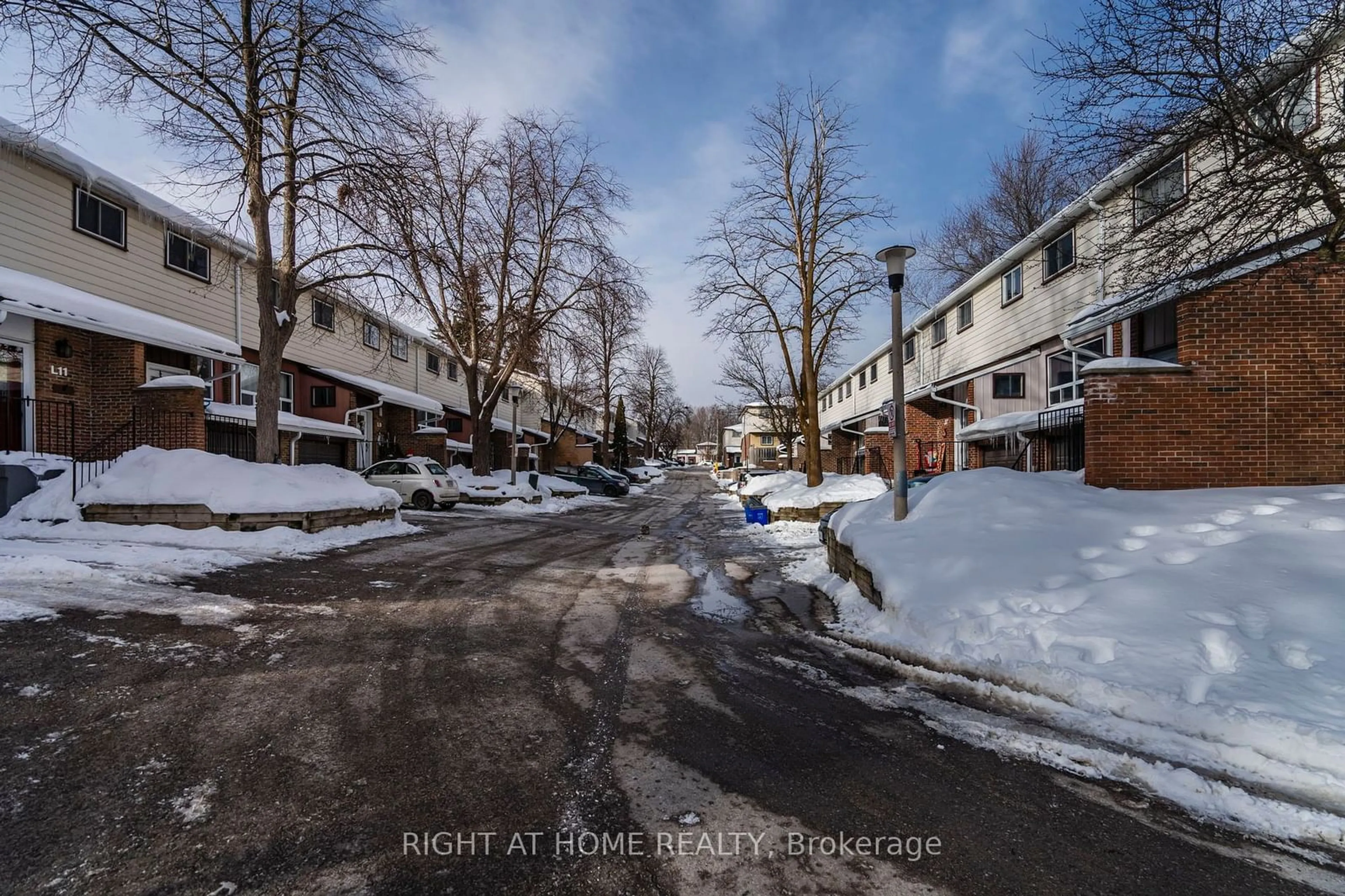 A pic from outside/outdoor area/front of a property/back of a property/a pic from drone, street for 63 Ferris Lane #J5, Barrie Ontario L4M 5C4