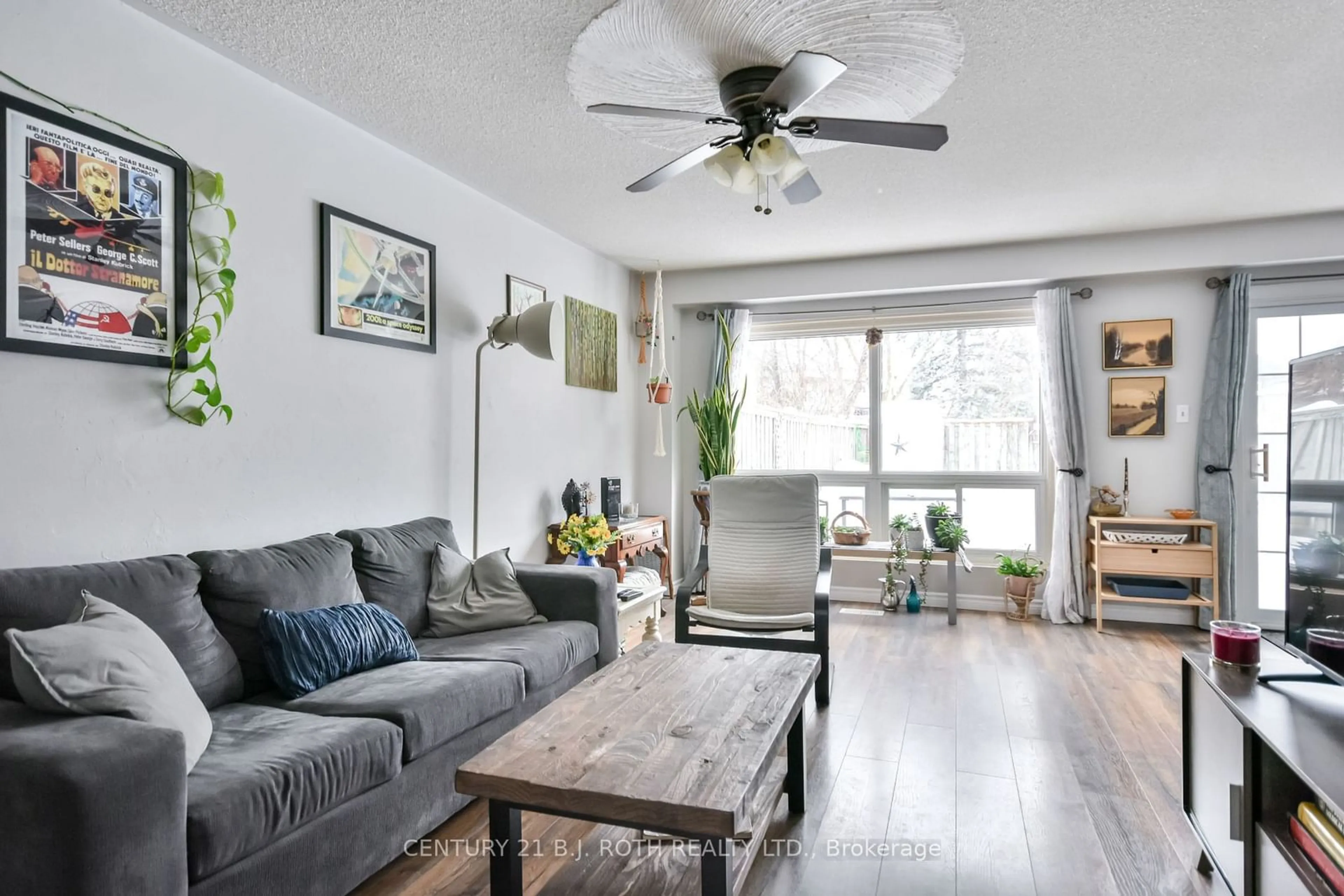 Living room with furniture, wood/laminate floor for 57 Highcroft Rd, Barrie Ontario L4N 2X6