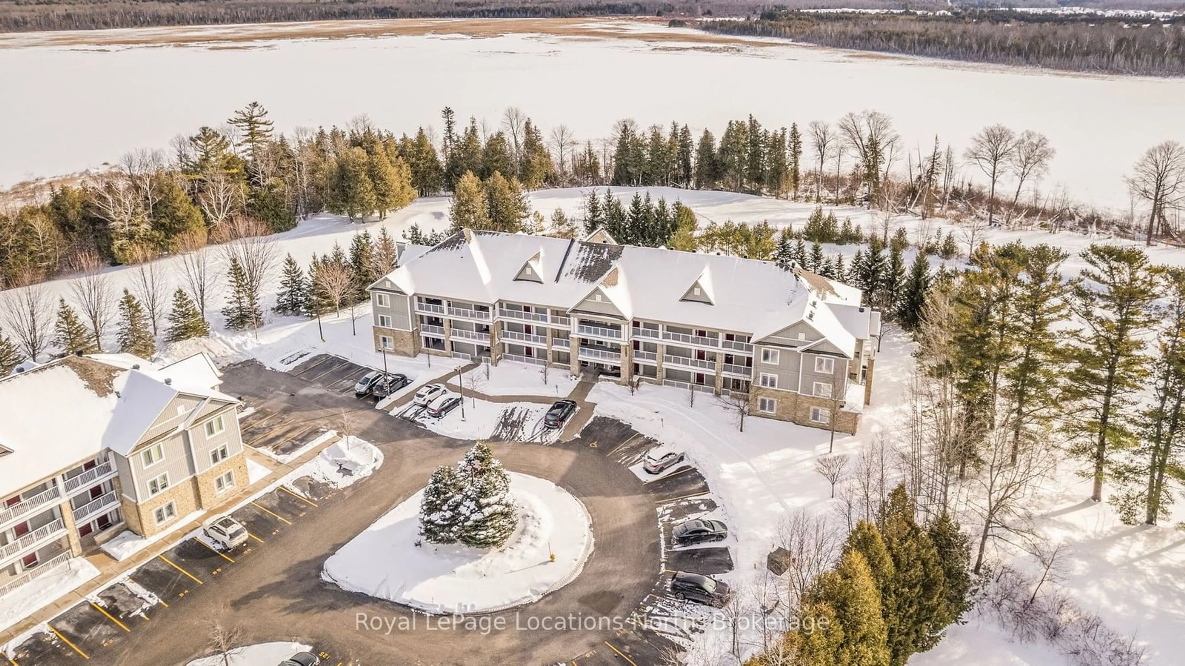 A pic from outside/outdoor area/front of a property/back of a property/a pic from drone, water/lake/river/ocean view for 60 Mulligan Lane #323, Wasaga Beach Ontario L9Z 0C5