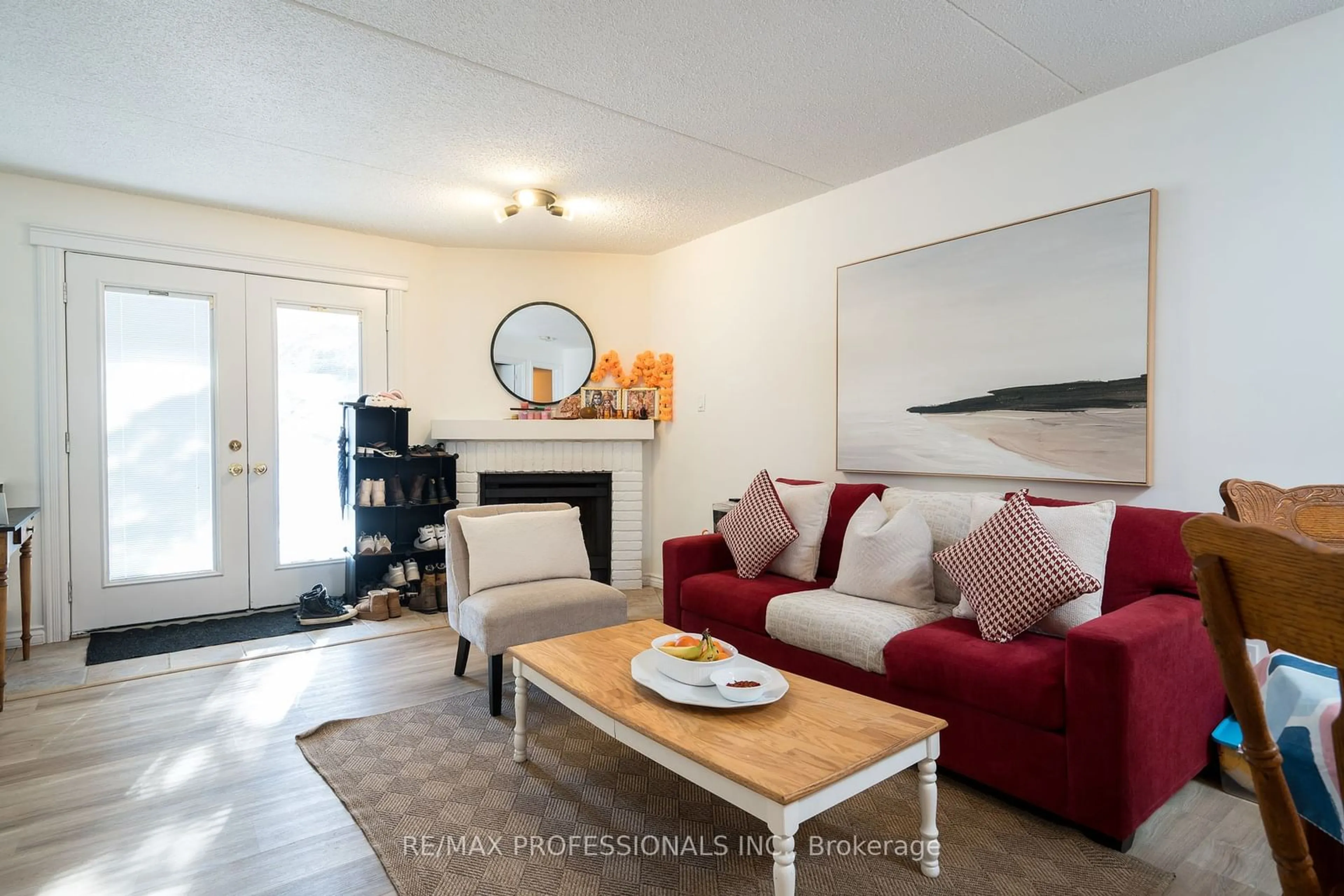 Living room with furniture, wood/laminate floor for 11 Dawson Dr #721, Collingwood Ontario L9Y 5B4