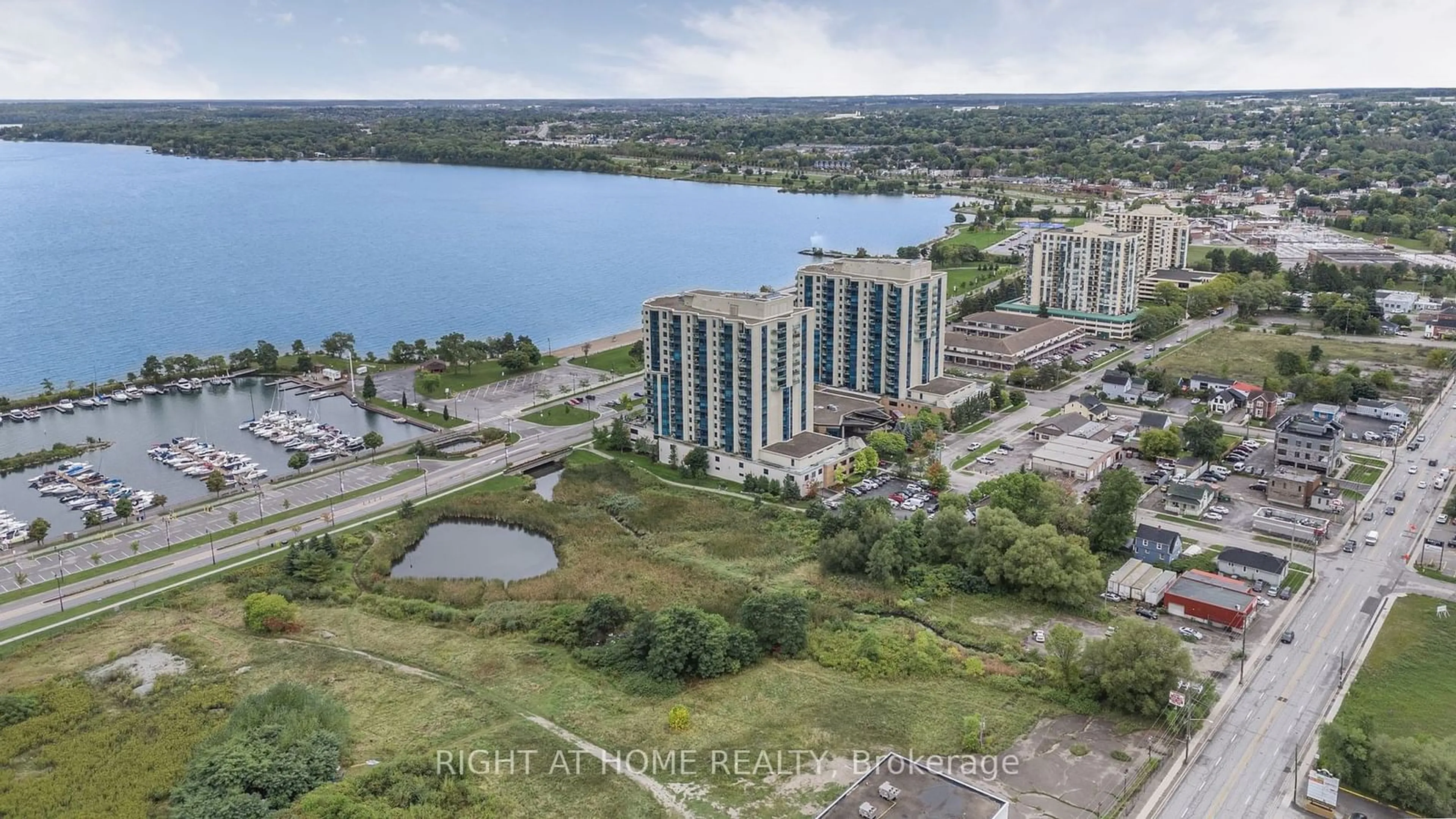 A pic from outside/outdoor area/front of a property/back of a property/a pic from drone, water/lake/river/ocean view for 2 Toronto St #401, Barrie Ontario L4N 9R2