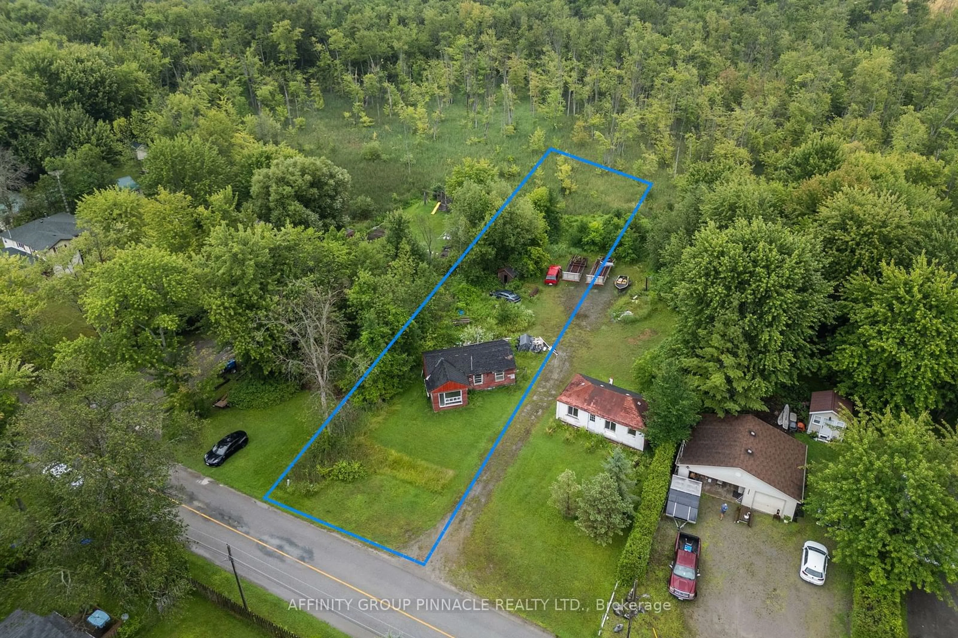 A pic from outside/outdoor area/front of a property/back of a property/a pic from drone, forest/trees view for 2559 Lakeshore Dr #1 & 4, Ramara Ontario L0K 1B0