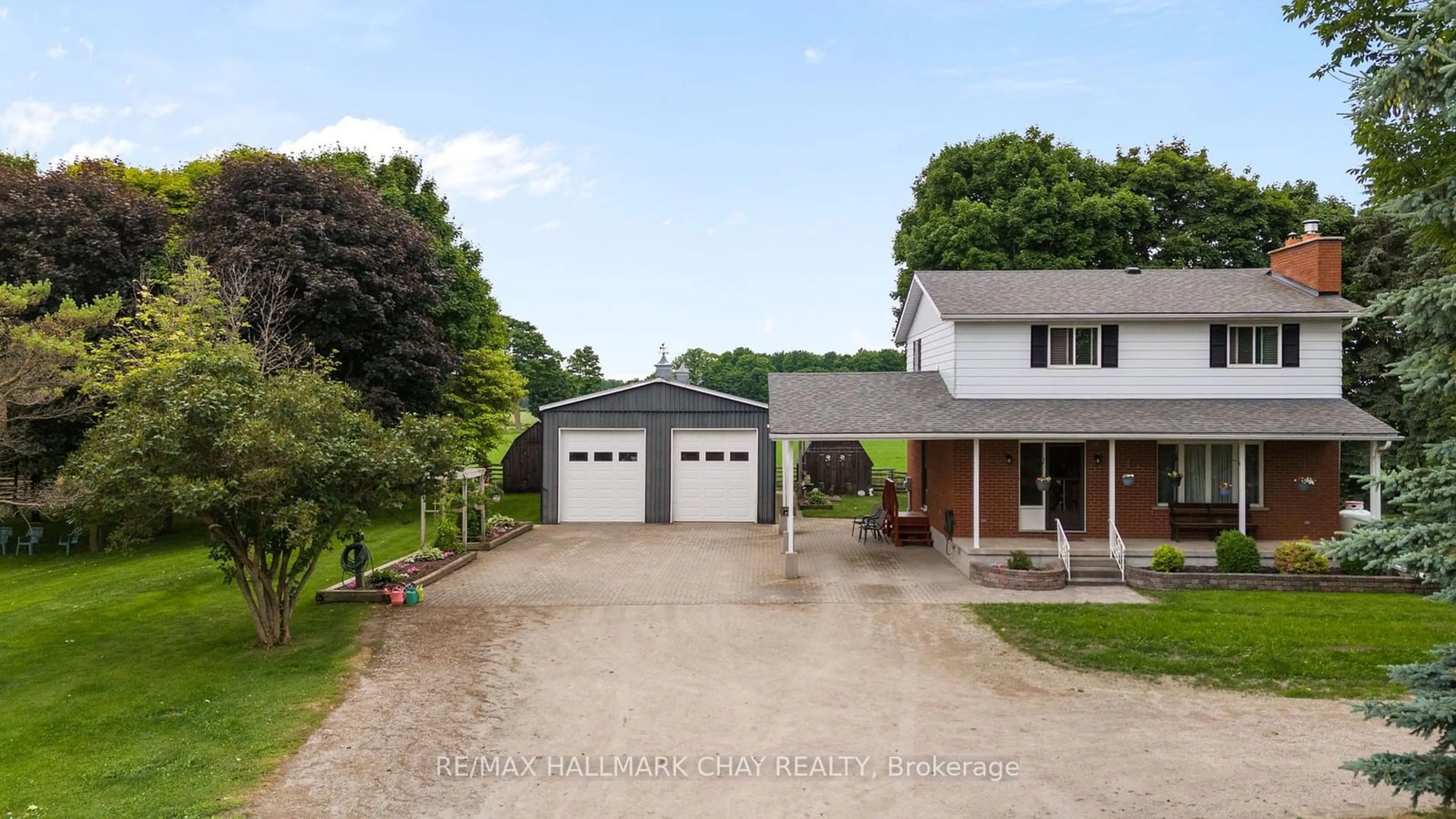 A pic from outside/outdoor area/front of a property/back of a property/a pic from drone, street for 3093 Hwy 26, Springwater Ontario L9X 0B5