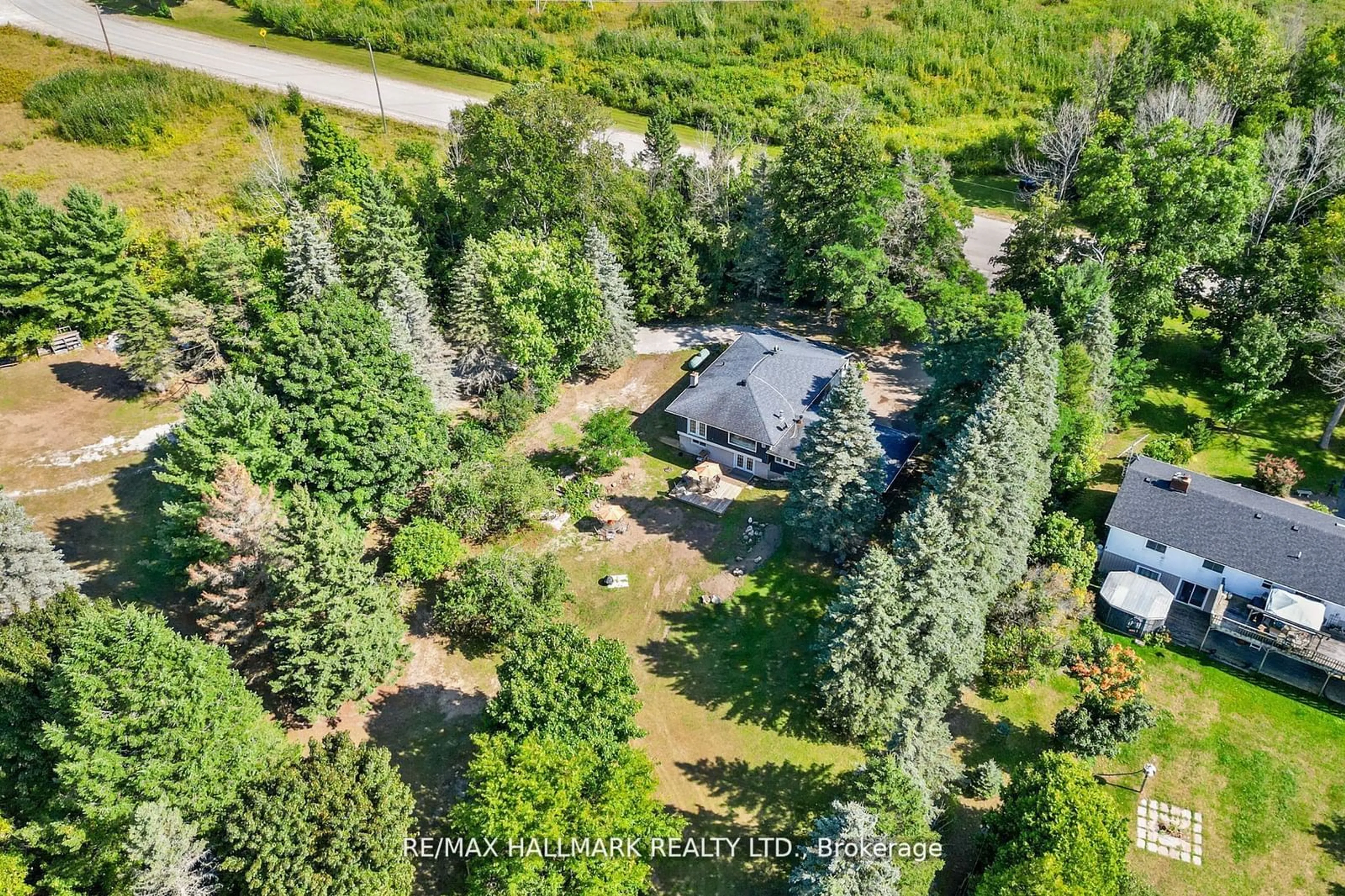 A pic from outside/outdoor area/front of a property/back of a property/a pic from drone, forest/trees view for 2422 Snow Valley Rd, Springwater Ontario L9X 1K1