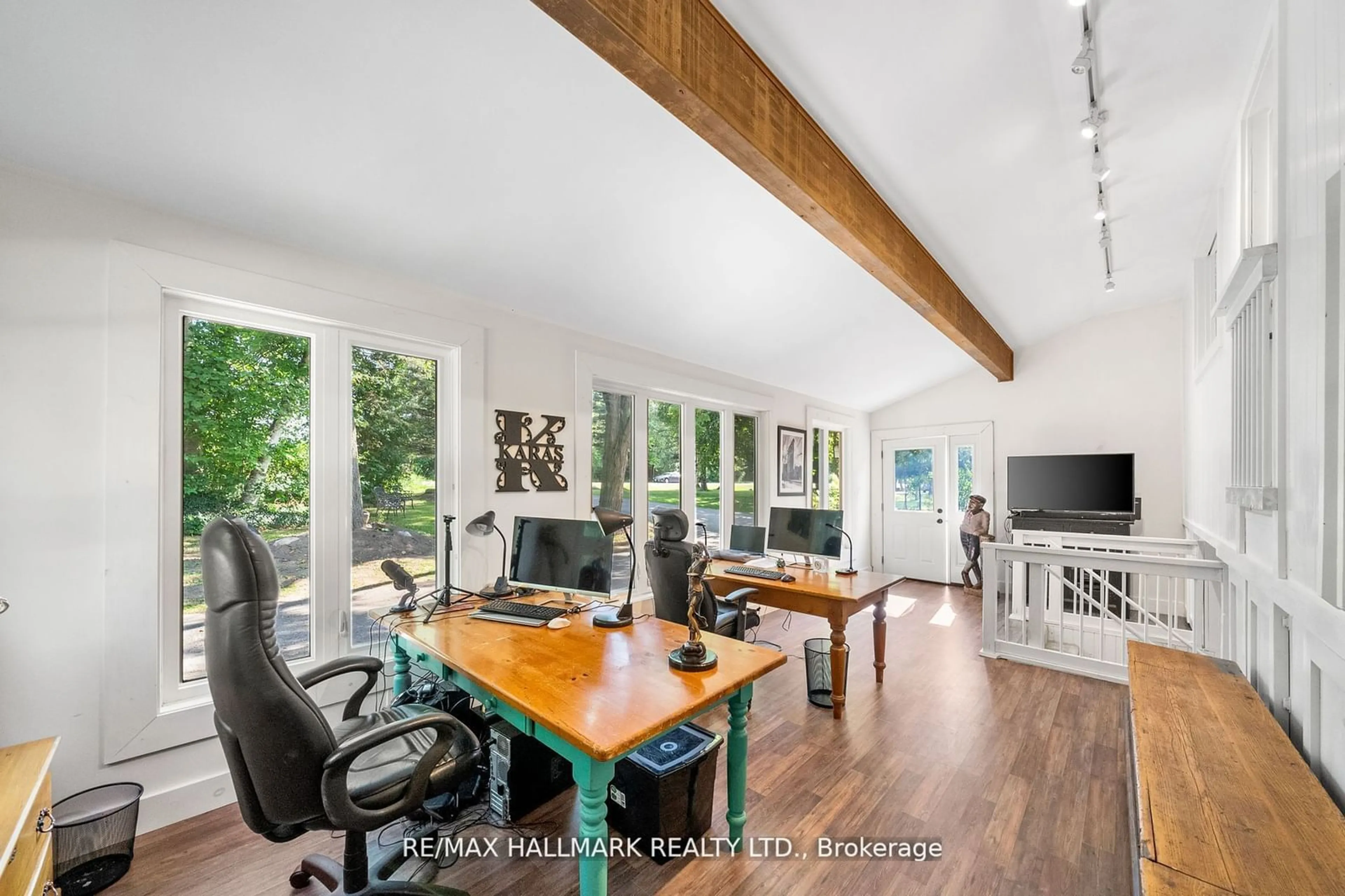 Living room with furniture, wood/laminate floor for 2422 Snow Valley Rd, Springwater Ontario L9X 1K1