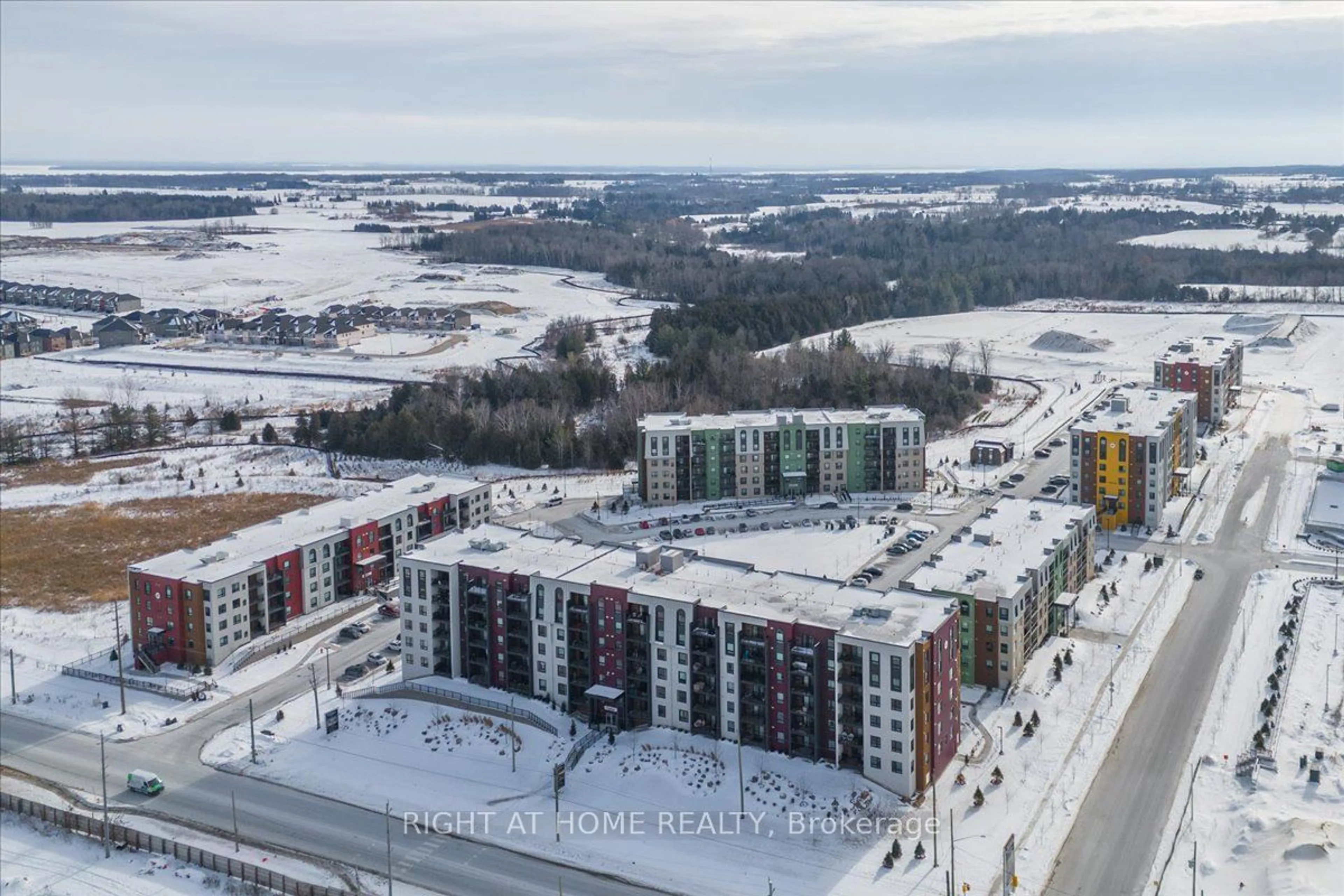 A pic from outside/outdoor area/front of a property/back of a property/a pic from drone, unknown for 4 Spice Way #210, Barrie Ontario L9J 0M2