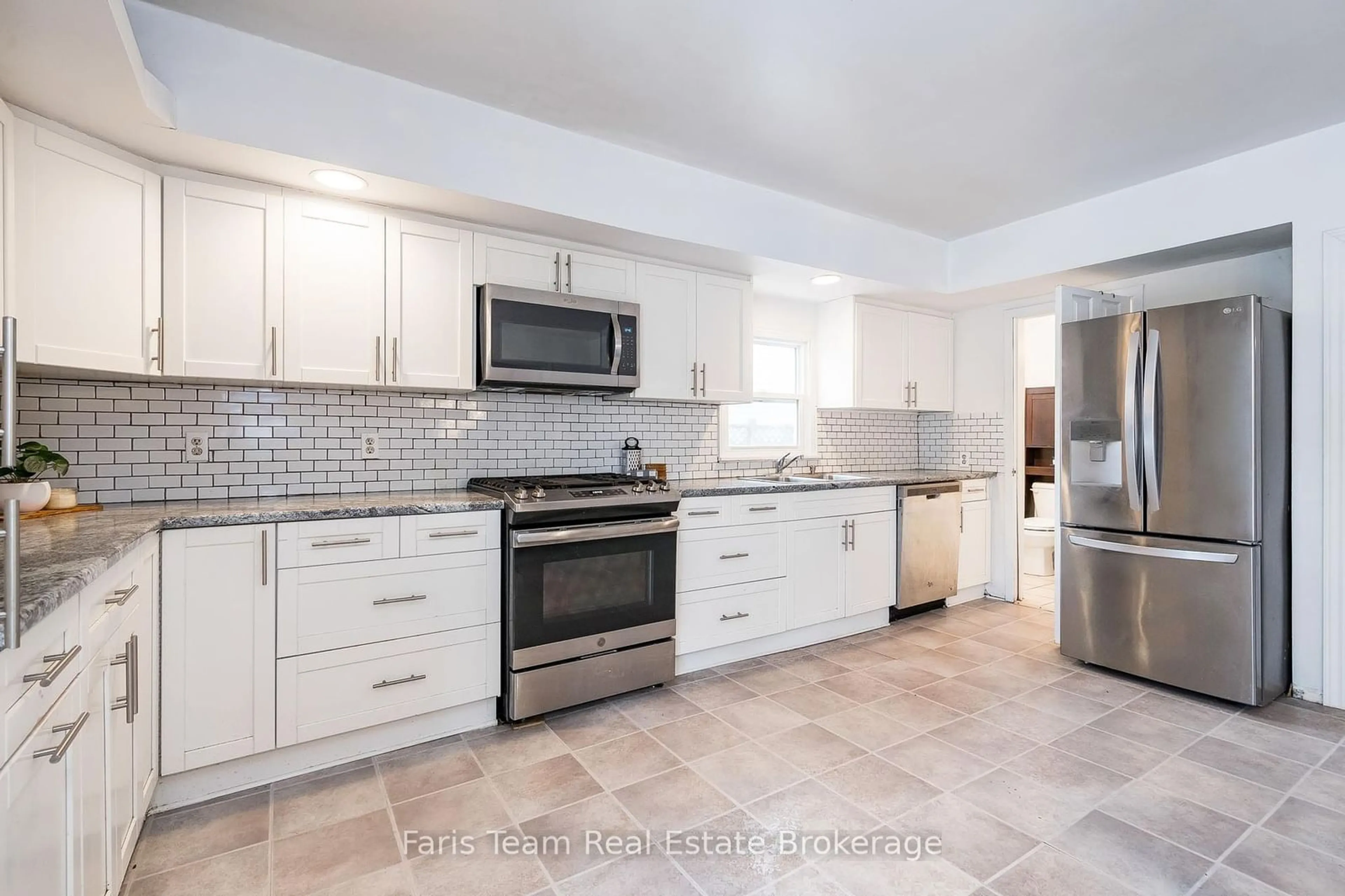 Open concept kitchen, ceramic/tile floor for 55 River Avenue Cres, Wasaga Beach Ontario L9Z 2K6