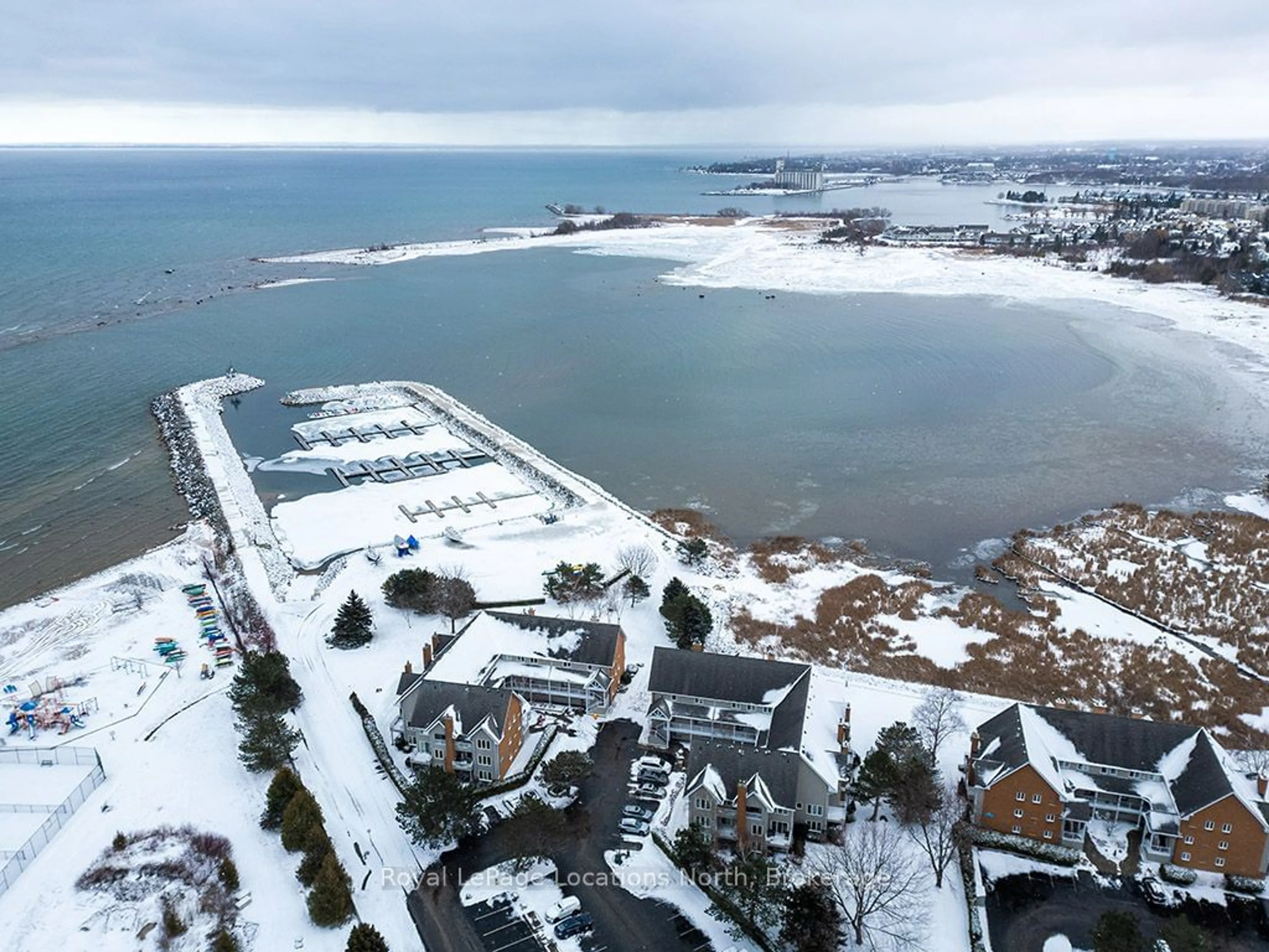 A pic from outside/outdoor area/front of a property/back of a property/a pic from drone, water/lake/river/ocean view for 8 Rambling Way #115, Collingwood Ontario L9Y 5C6