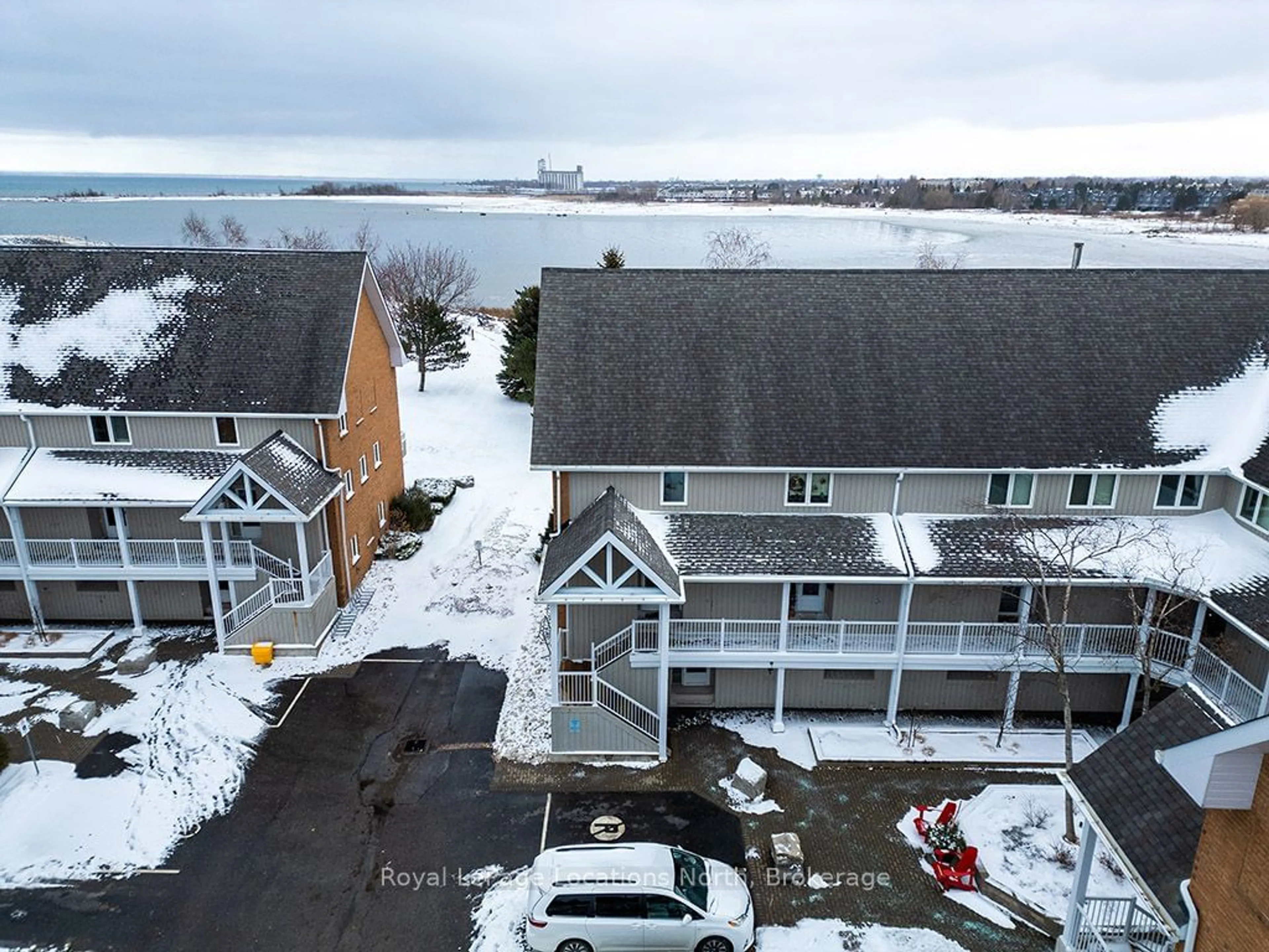 A pic from outside/outdoor area/front of a property/back of a property/a pic from drone, water/lake/river/ocean view for 8 Rambling Way #115, Collingwood Ontario L9Y 5C6