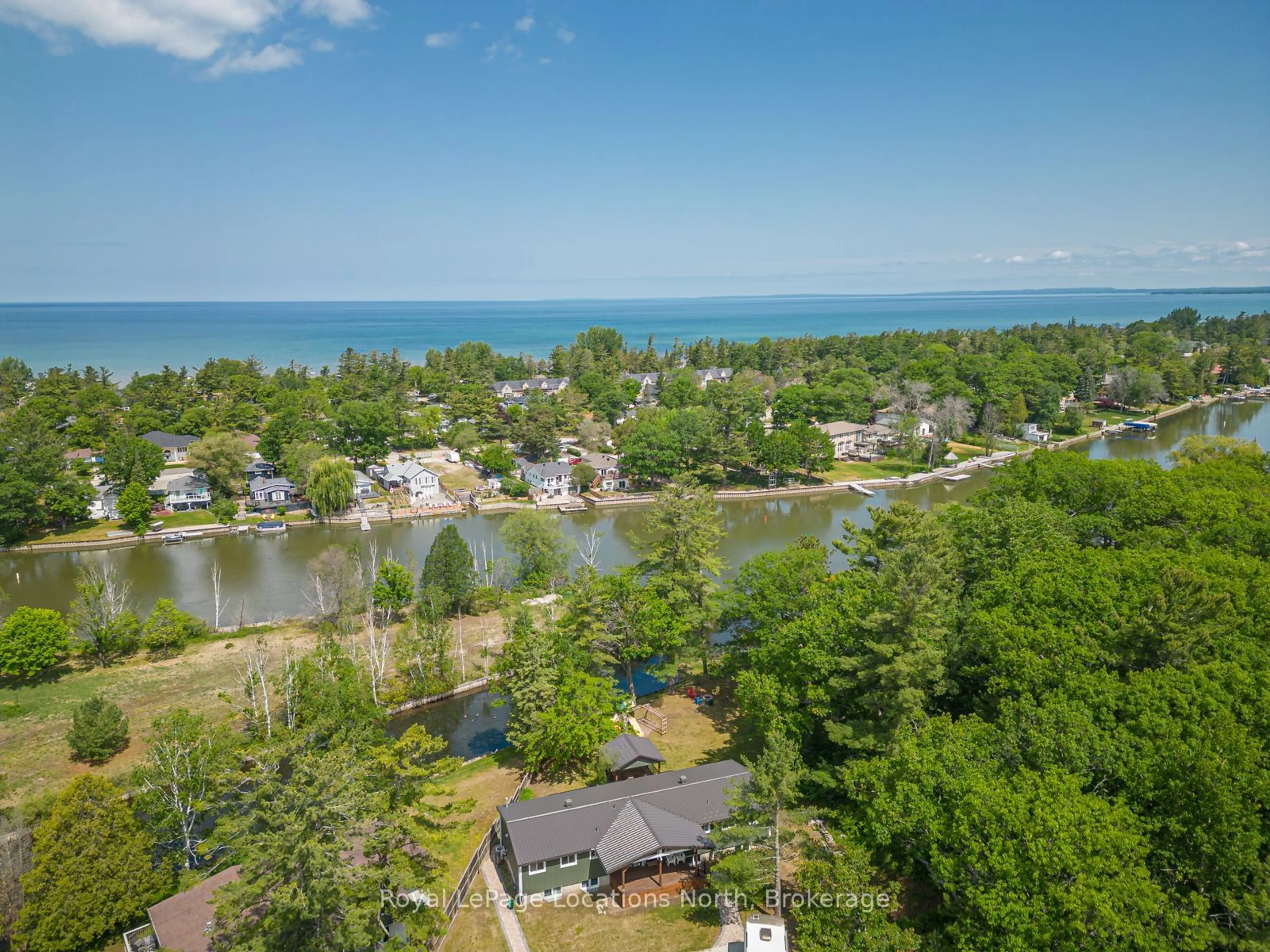 A pic from outside/outdoor area/front of a property/back of a property/a pic from drone, water/lake/river/ocean view for 1628 River Rd, Wasaga Beach Ontario L9Z 2S3