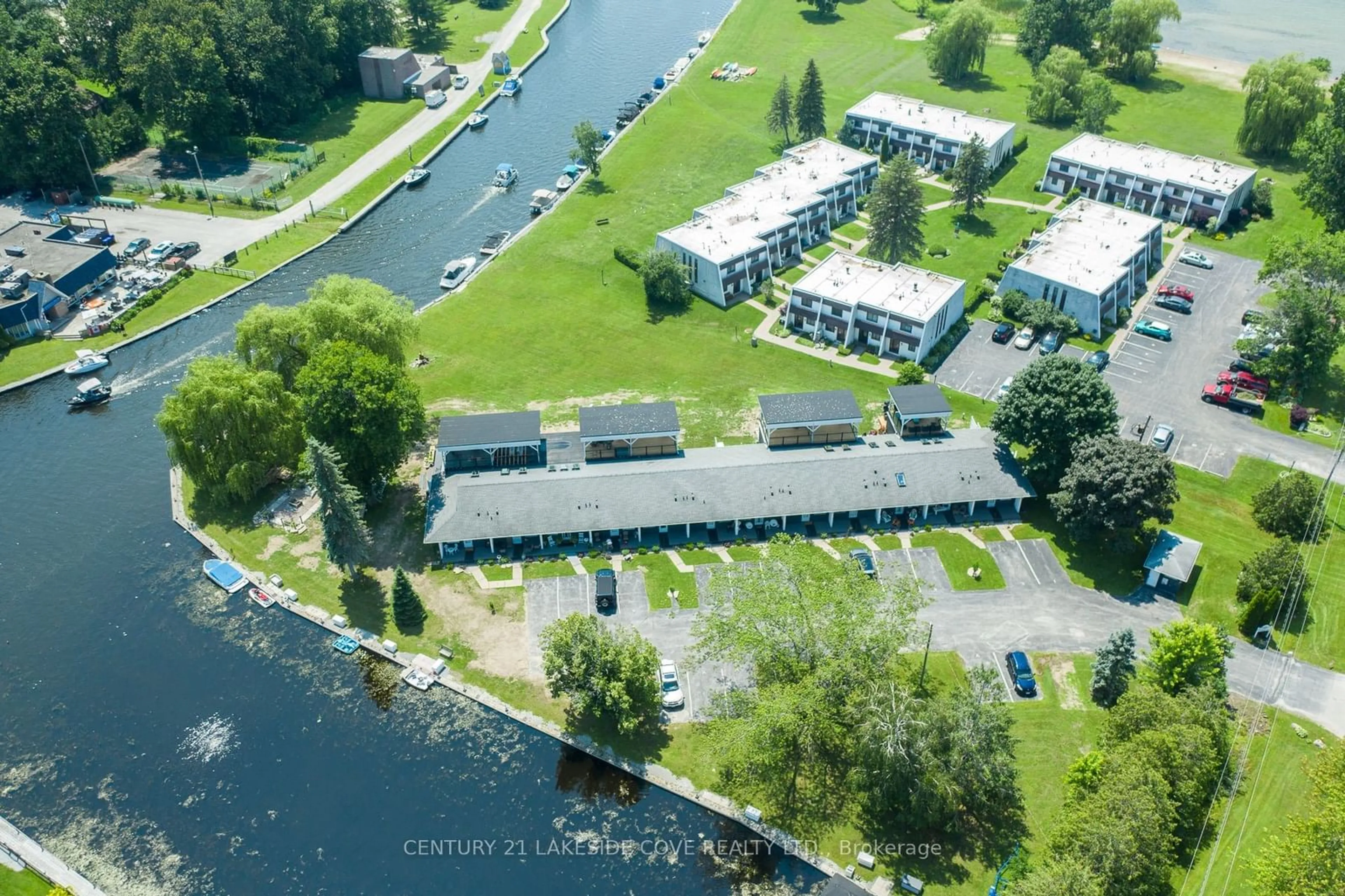 A pic from outside/outdoor area/front of a property/back of a property/a pic from drone, water/lake/river/ocean view for 3 Paradise Blvd #Unit 2, Ramara Ontario L0K 1B0