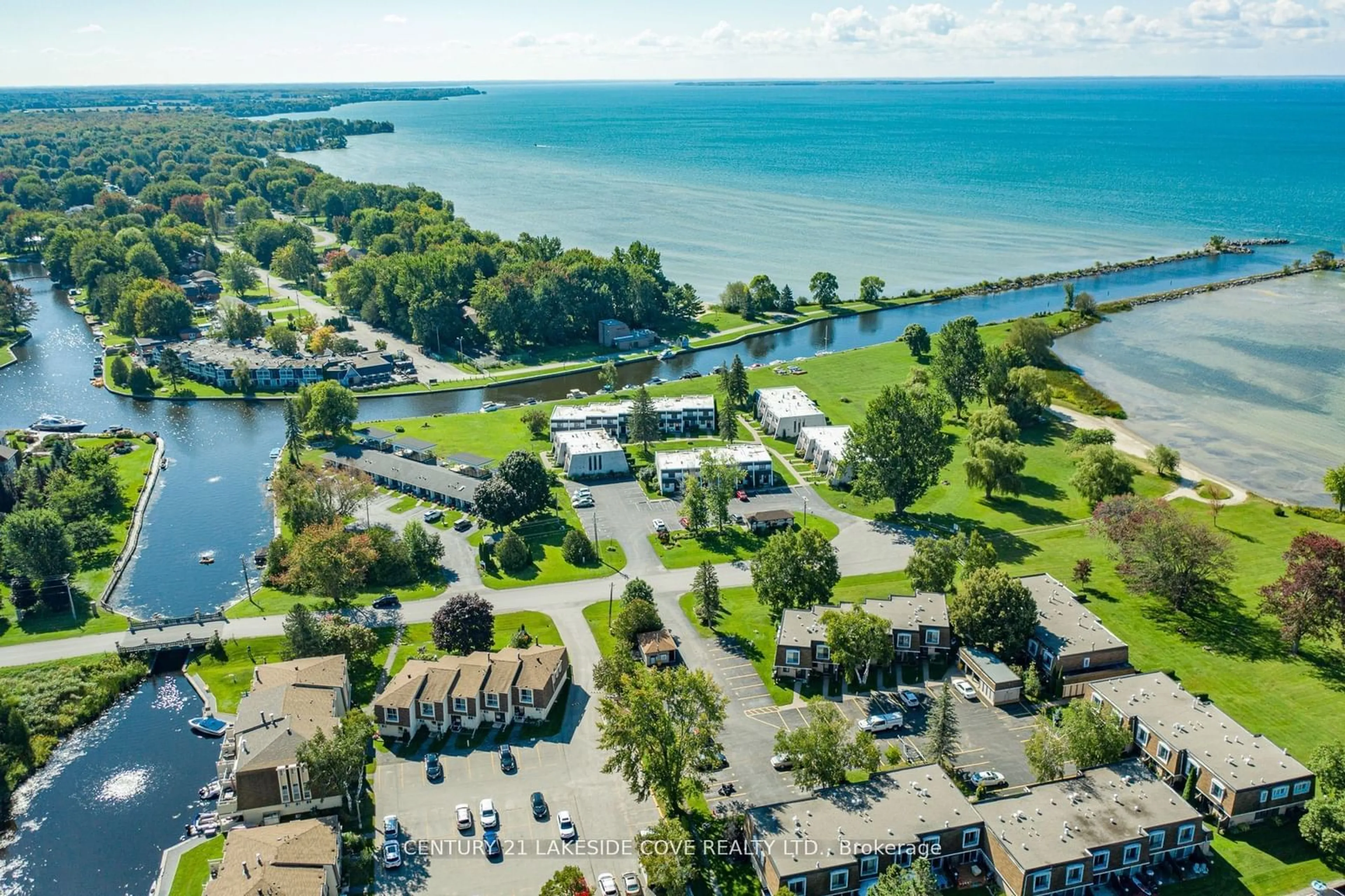 A pic from outside/outdoor area/front of a property/back of a property/a pic from drone, water/lake/river/ocean view for 3 Paradise Blvd #Unit 2, Ramara Ontario L0K 1B0