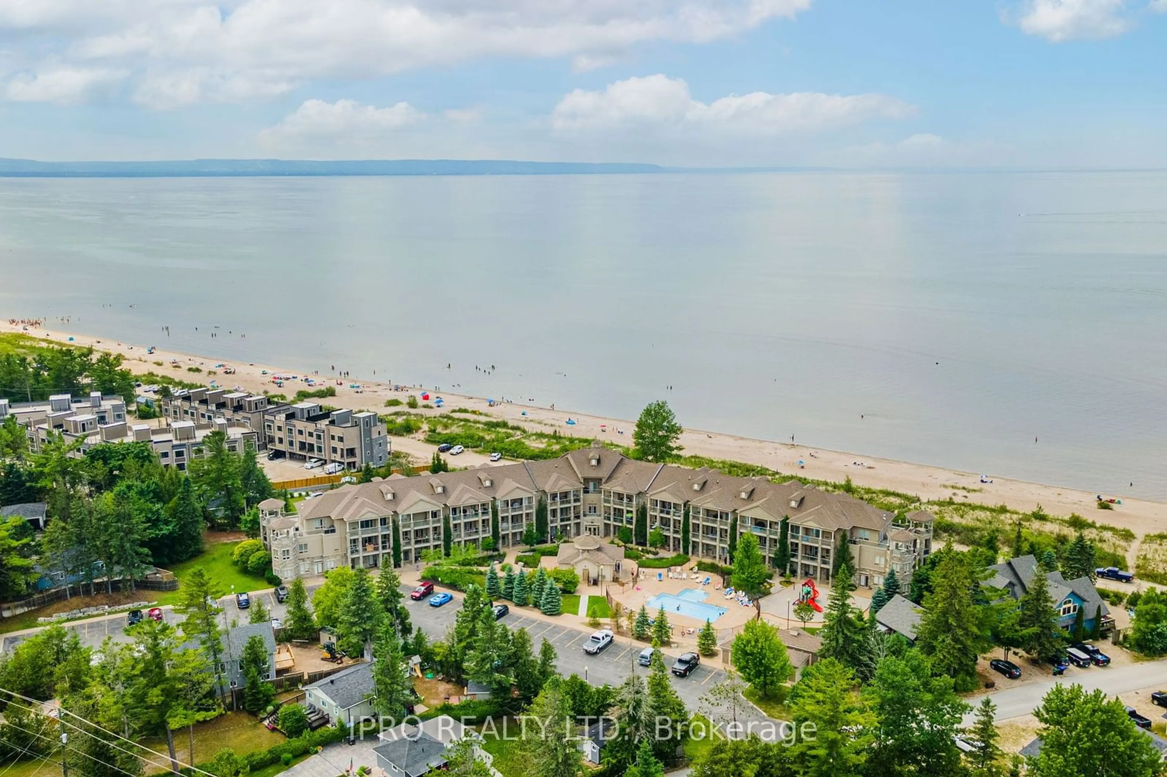 A pic from outside/outdoor area/front of a property/back of a property/a pic from drone, water/lake/river/ocean view for 764 River Rd #201, Wasaga Beach Ontario L9Z 2M7