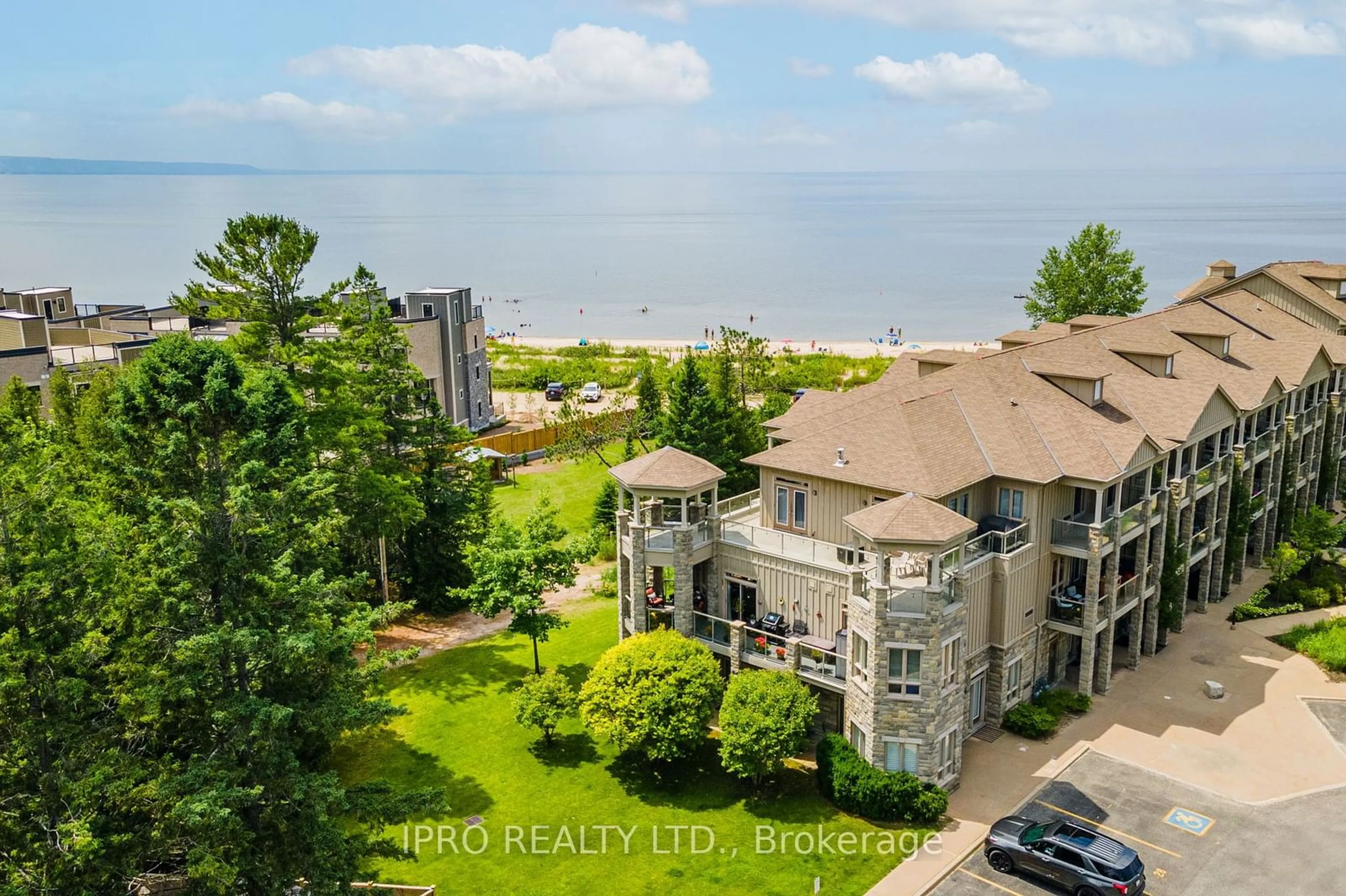 A pic from outside/outdoor area/front of a property/back of a property/a pic from drone, water/lake/river/ocean view for 764 River Rd #201, Wasaga Beach Ontario L9Z 2M7