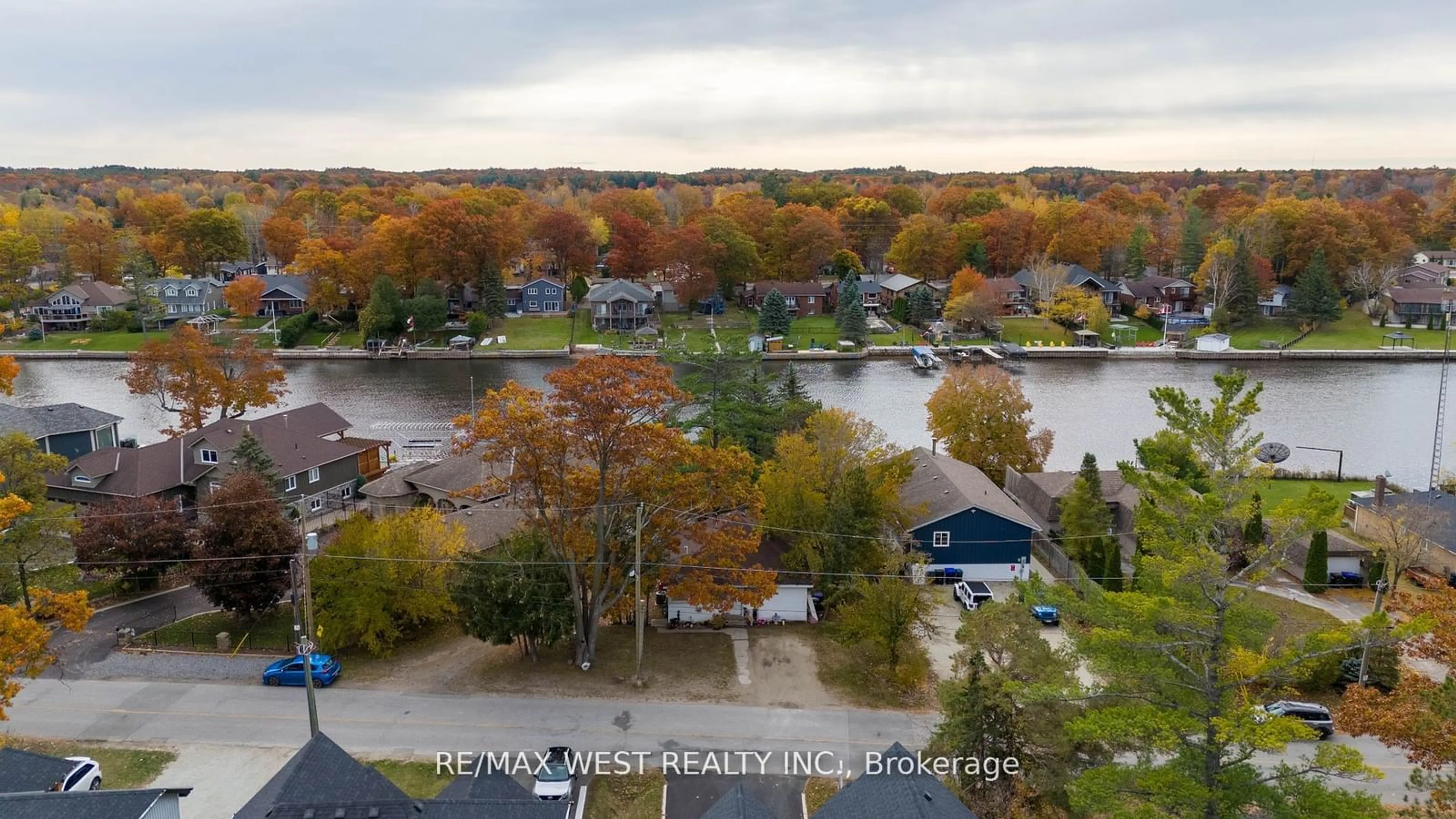 A pic from outside/outdoor area/front of a property/back of a property/a pic from drone, water/lake/river/ocean view for 75 Old Mosley St, Wasaga Beach Ontario L9Z 2X1