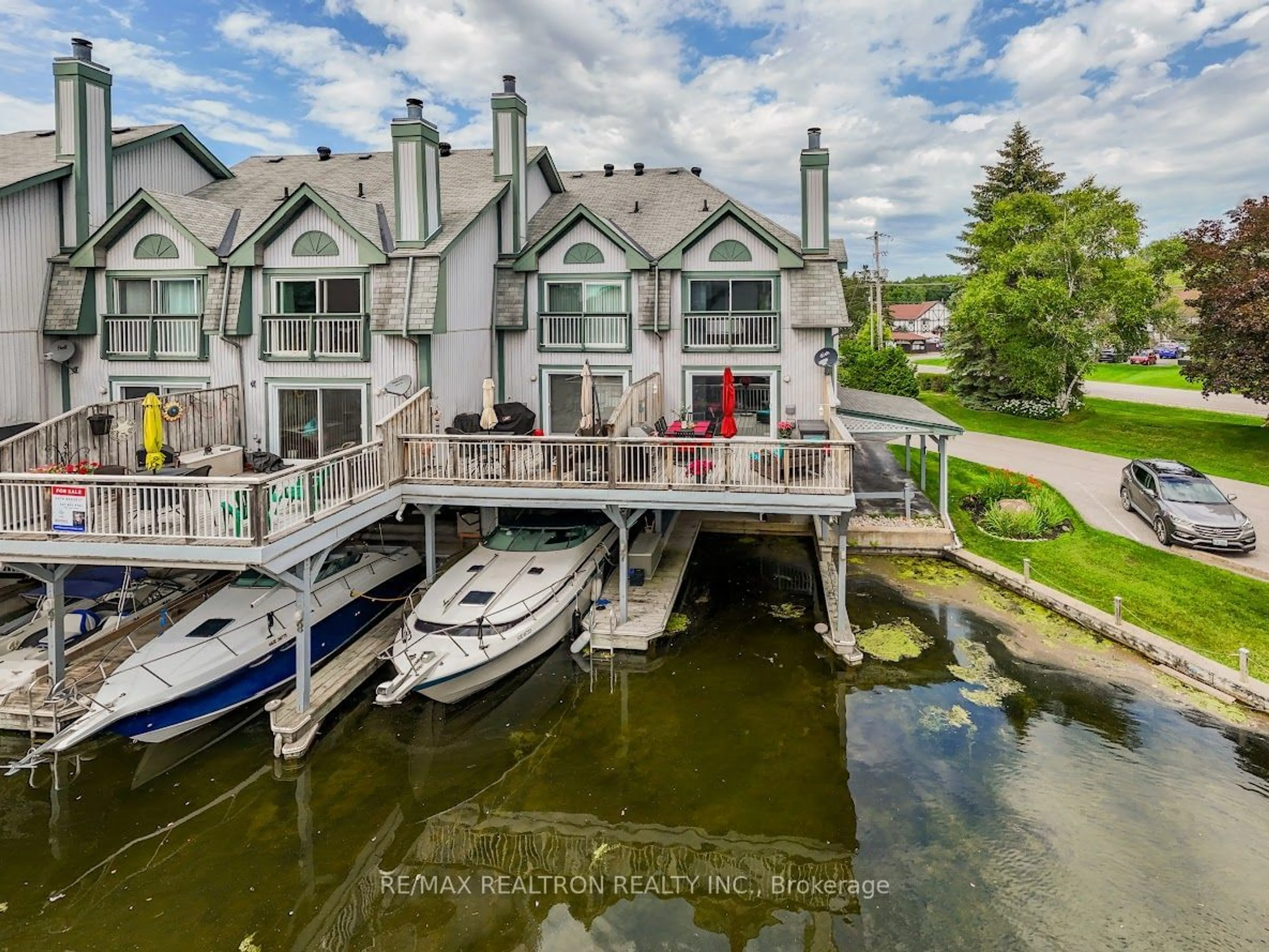 A pic from outside/outdoor area/front of a property/back of a property/a pic from drone, water/lake/river/ocean view for 24 Laguna Pkwy #7, Ramara Ontario L0K 1B0