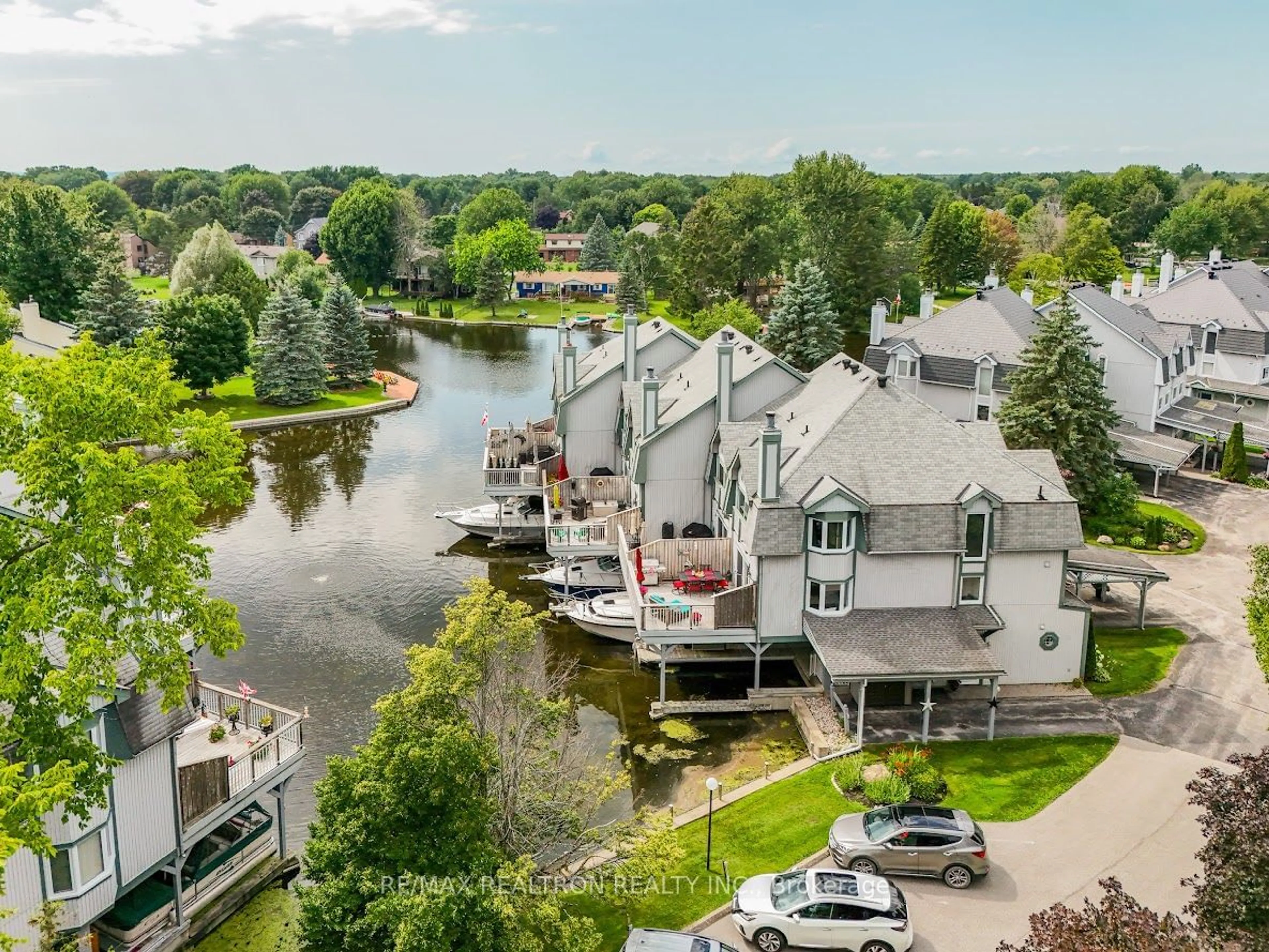 A pic from outside/outdoor area/front of a property/back of a property/a pic from drone, water/lake/river/ocean view for 24 Laguna Pkwy #7, Ramara Ontario L0K 1B0