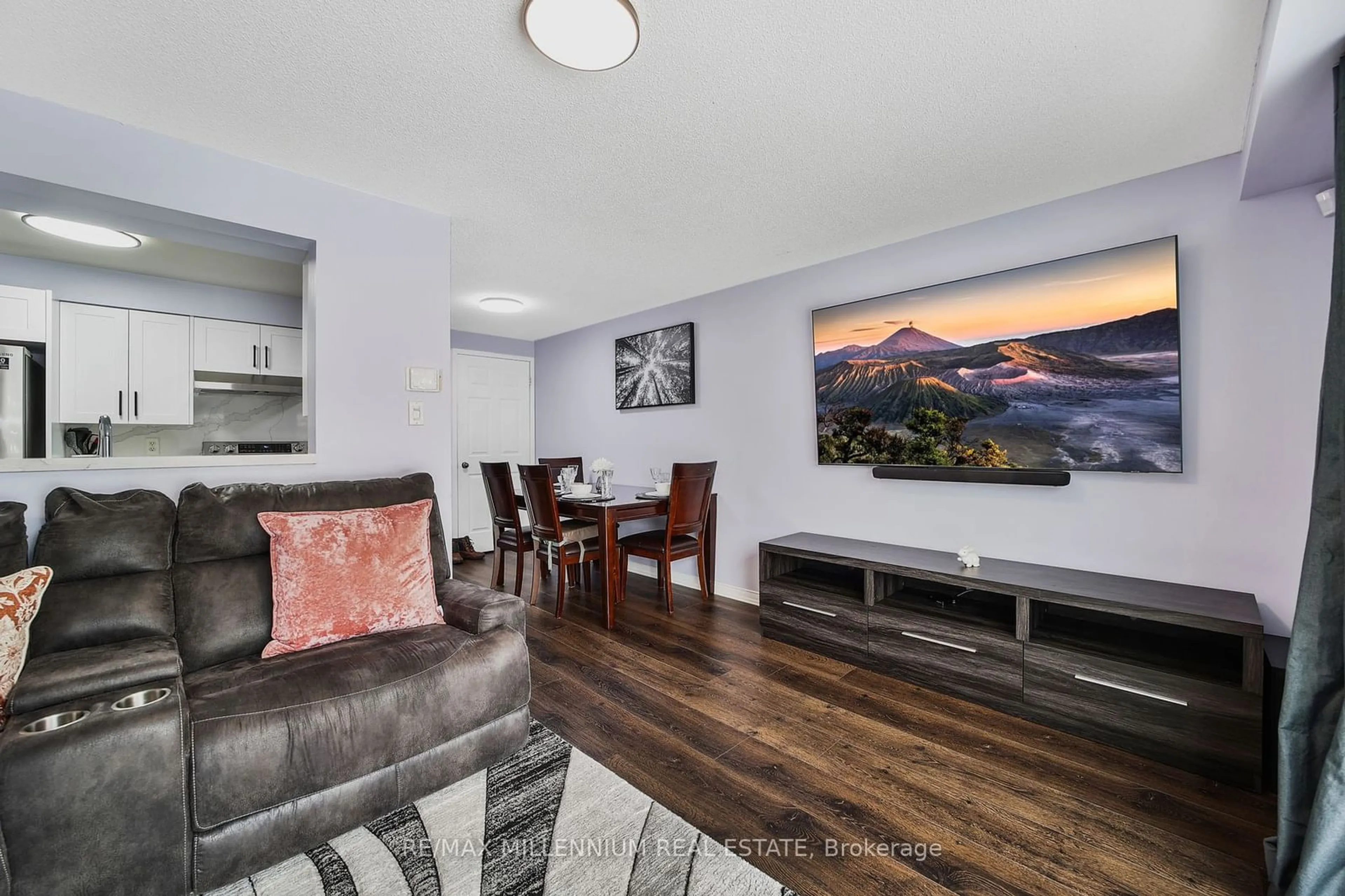Living room with furniture, wood/laminate floor for 313 Dunsmore Lane, Barrie Ontario L4M 7A8