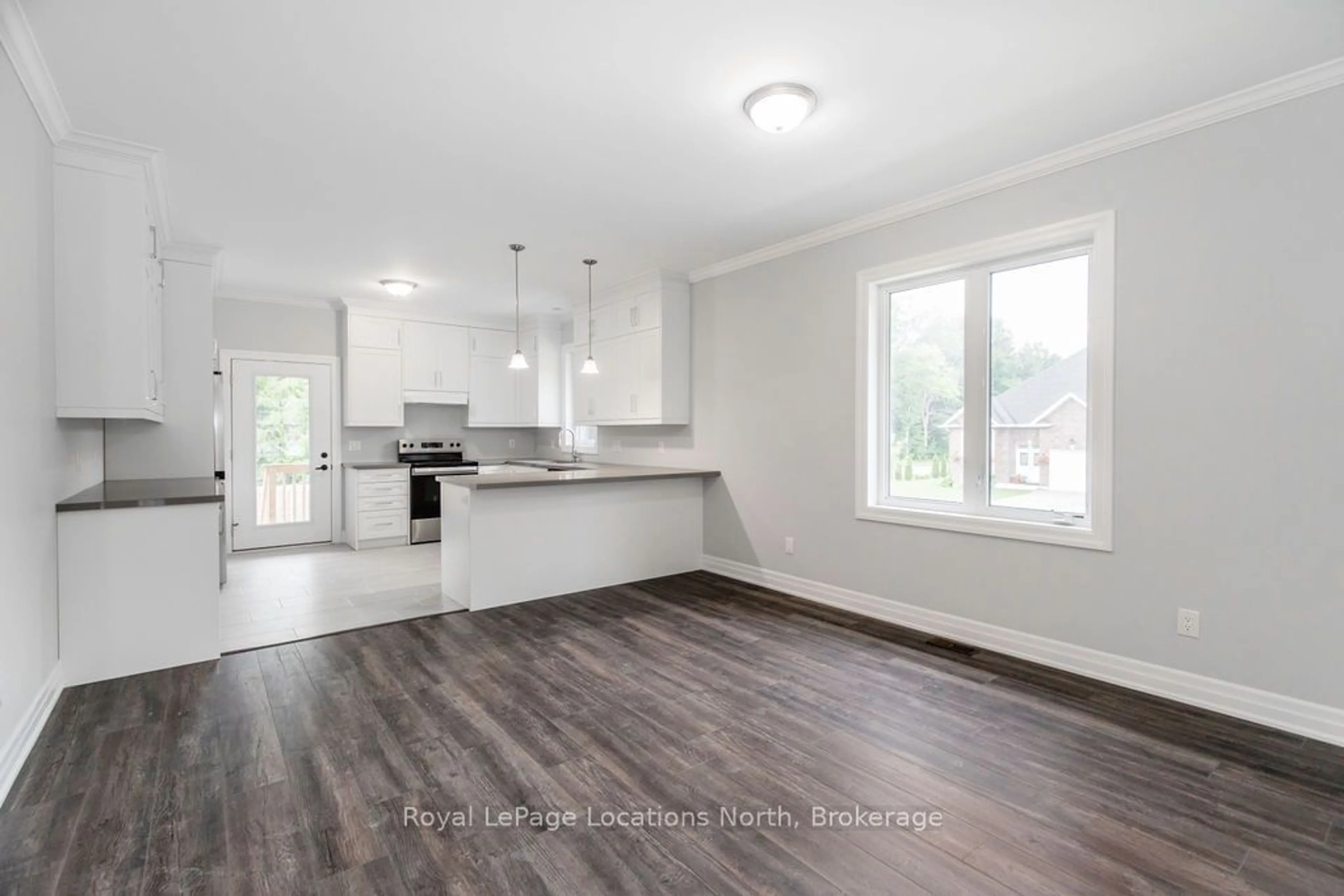 Open concept kitchen, wood/laminate floor for 51 NATURES Tr, Wasaga Beach Ontario L9Z 0H4