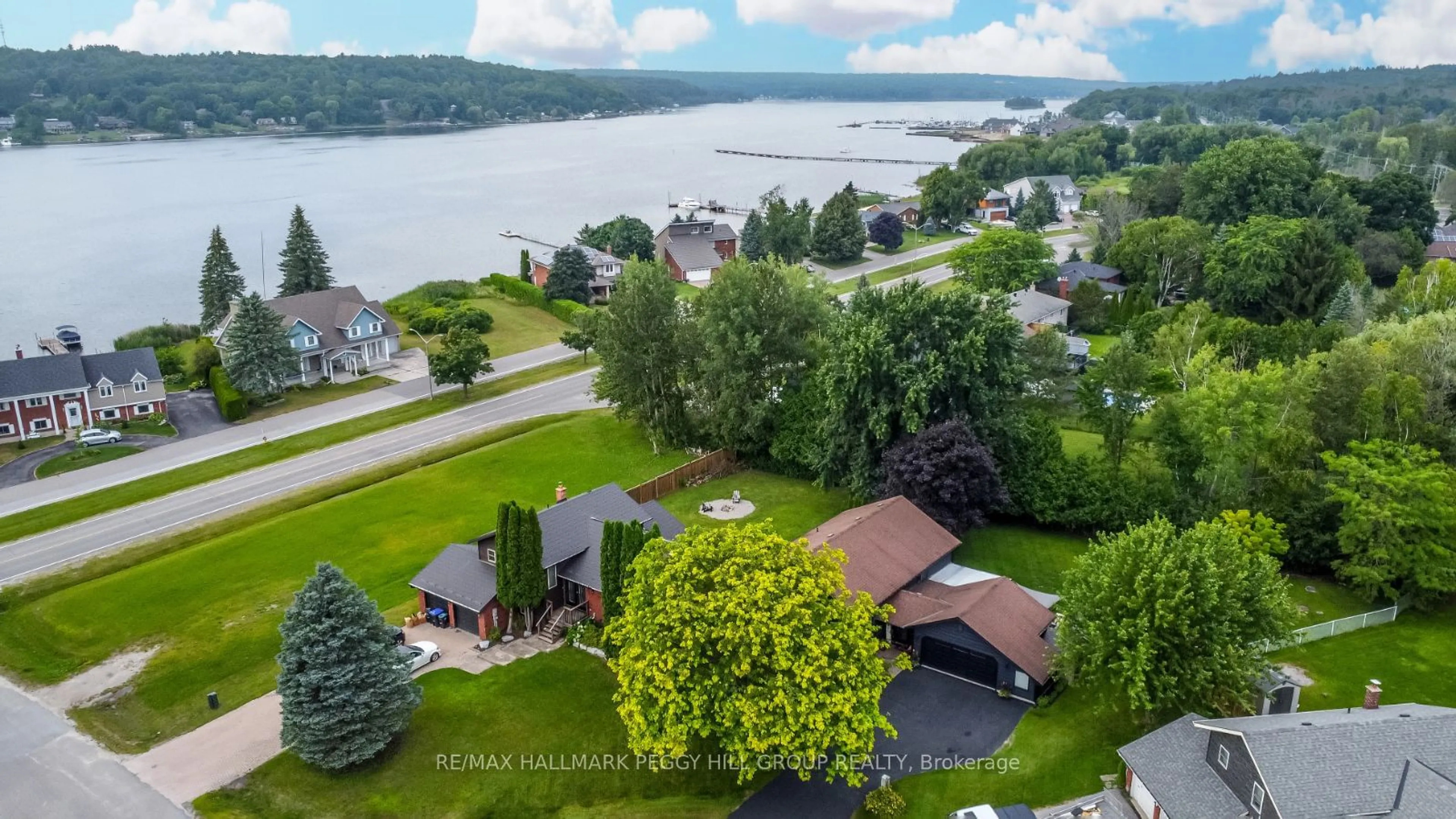 A pic from outside/outdoor area/front of a property/back of a property/a pic from drone, water/lake/river/ocean view for 7 Bay Crt, Penetanguishene Ontario L9M 1E1