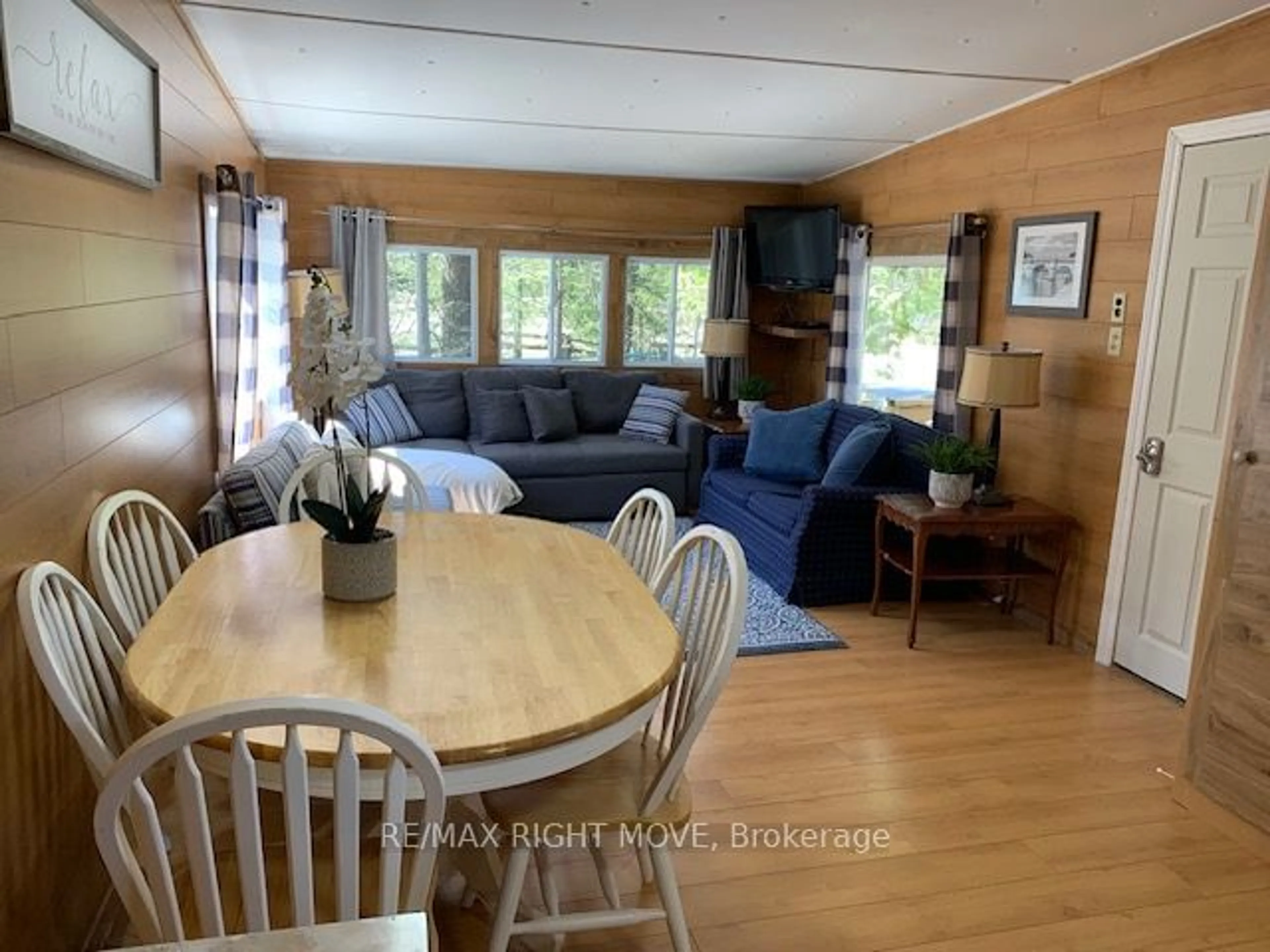 Living room with furniture, wood/laminate floor for 11 Stoney Rd, Tiny Ontario L9M 0H2