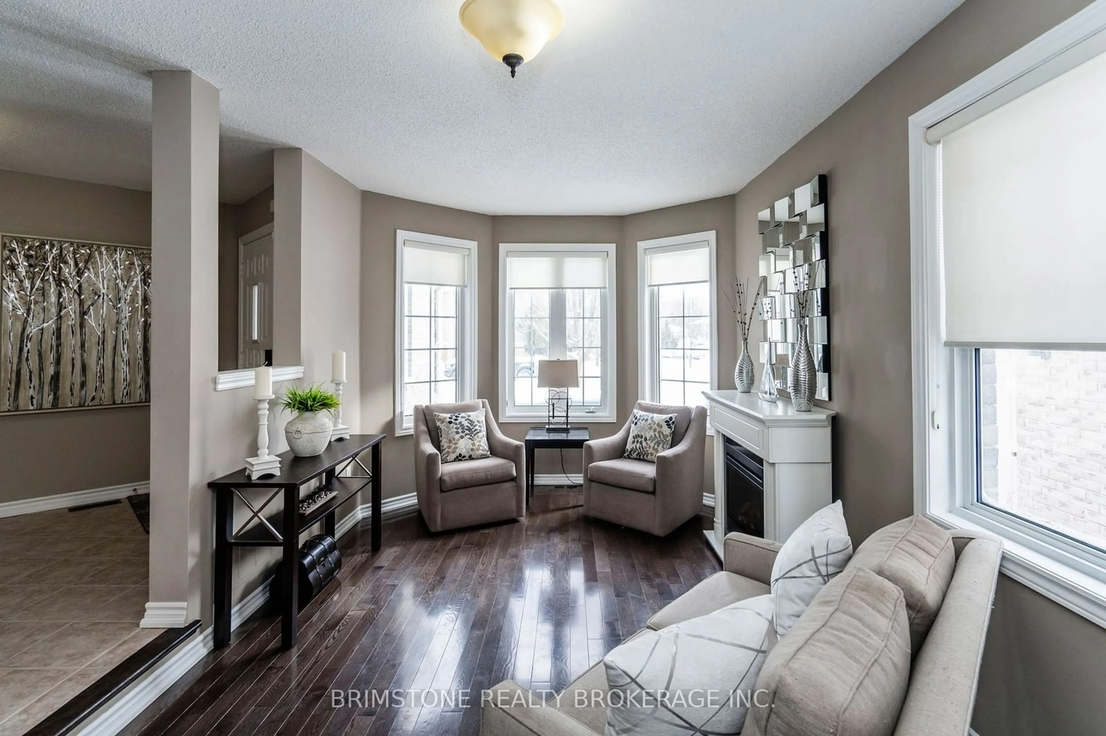 Living room with furniture, wood/laminate floor for 90 Kraus Rd, Barrie Ontario L4N 0N7