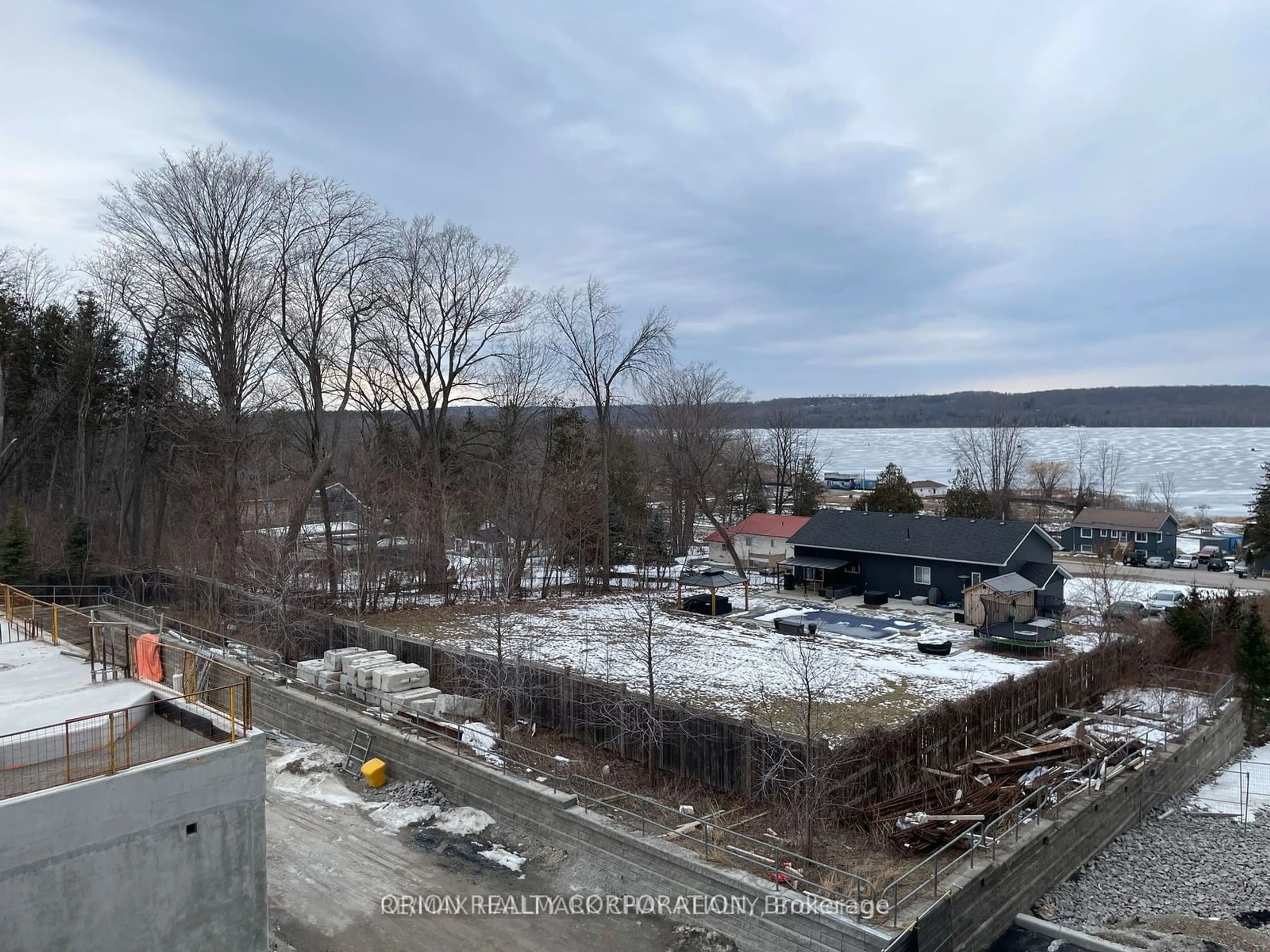 A pic from outside/outdoor area/front of a property/back of a property/a pic from drone, water/lake/river/ocean view for 56 Lakeside Terr #202, Barrie Ontario L4M 7B9