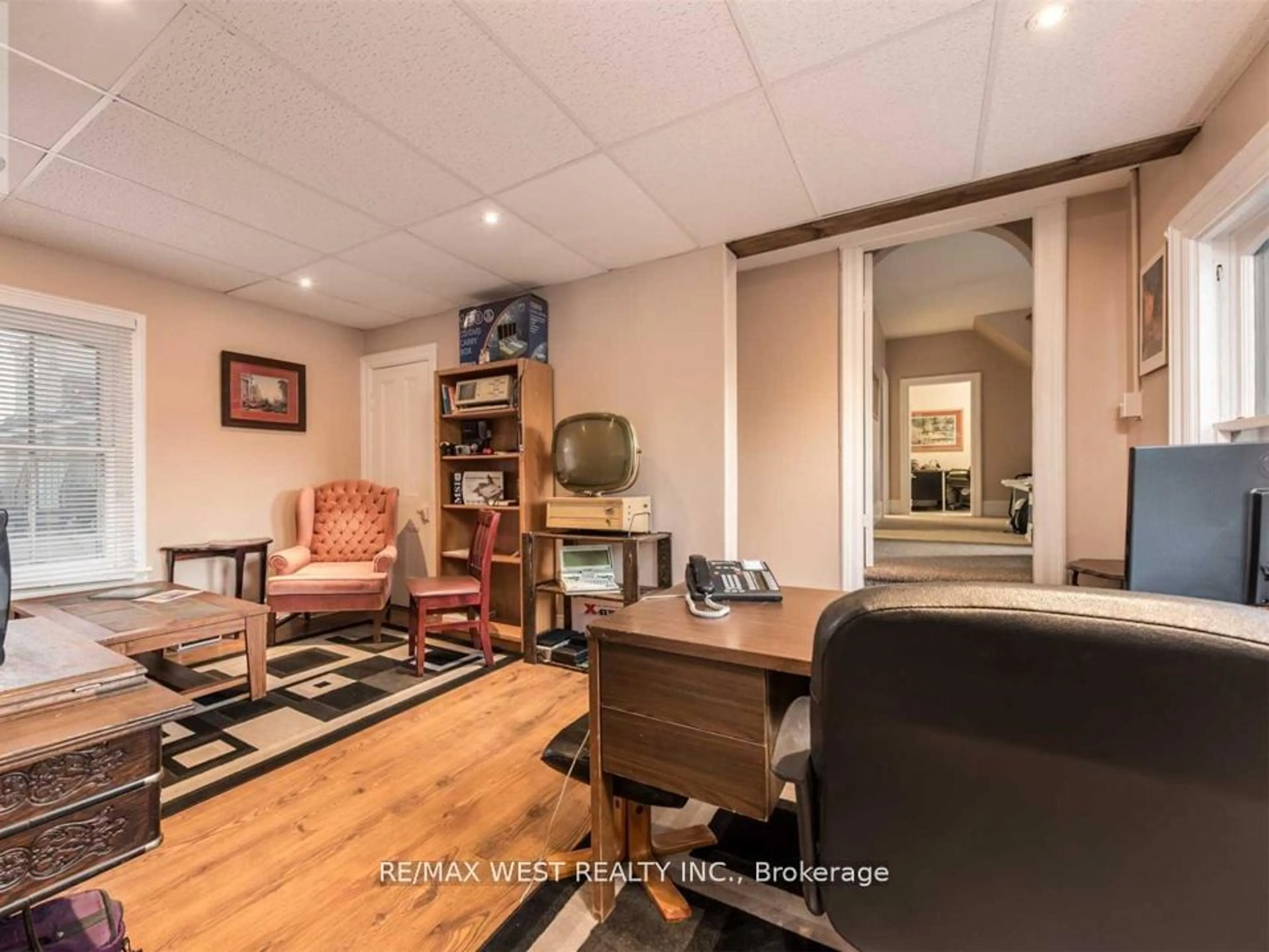 Living room with furniture, wood/laminate floor for 169 Bayfield St, Barrie Ontario L4M 3B4
