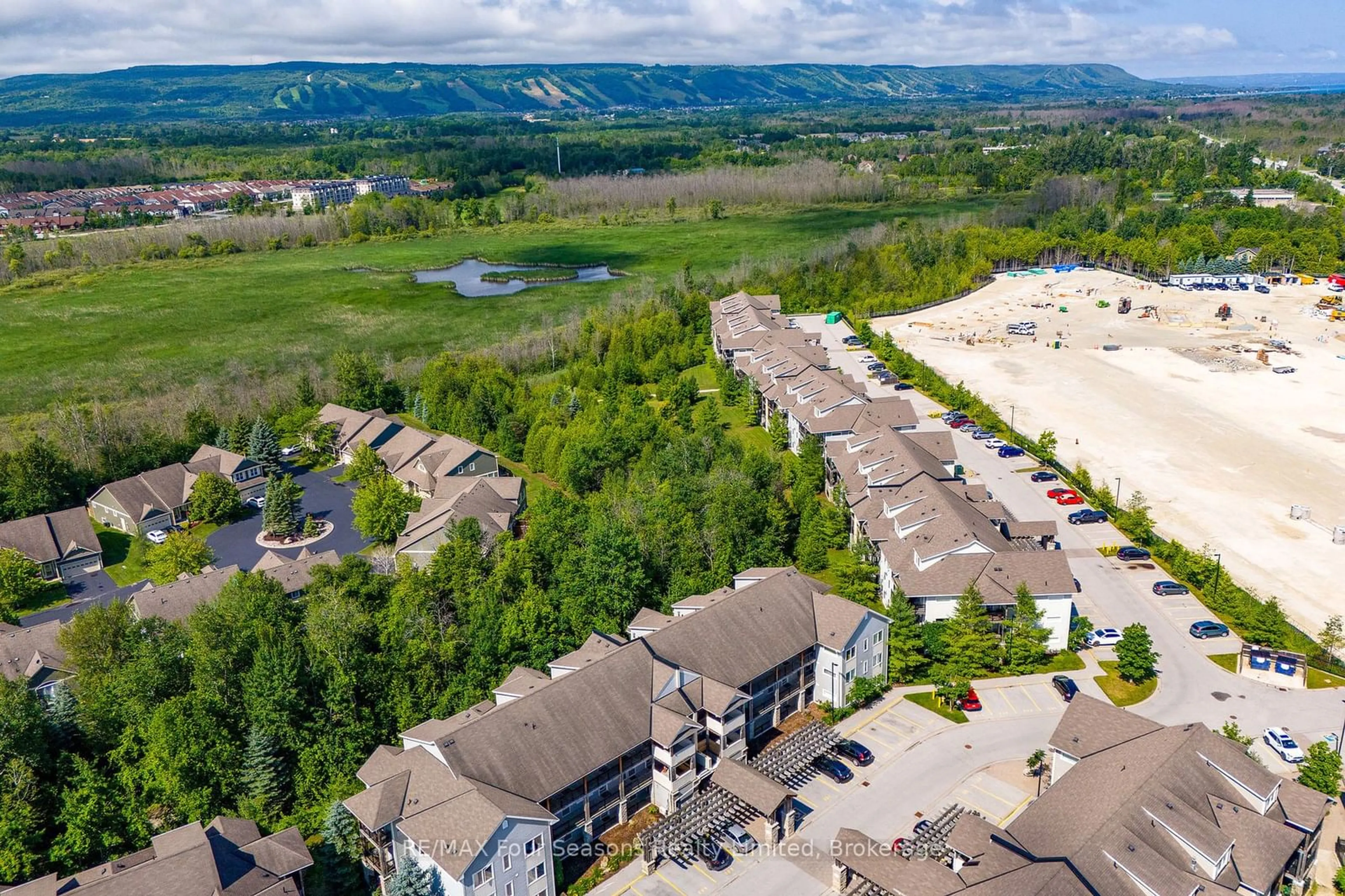 A pic from outside/outdoor area/front of a property/back of a property/a pic from drone, water/lake/river/ocean view for 10 BRANDY LANE Dr #302, Collingwood Ontario L9Y 0X4