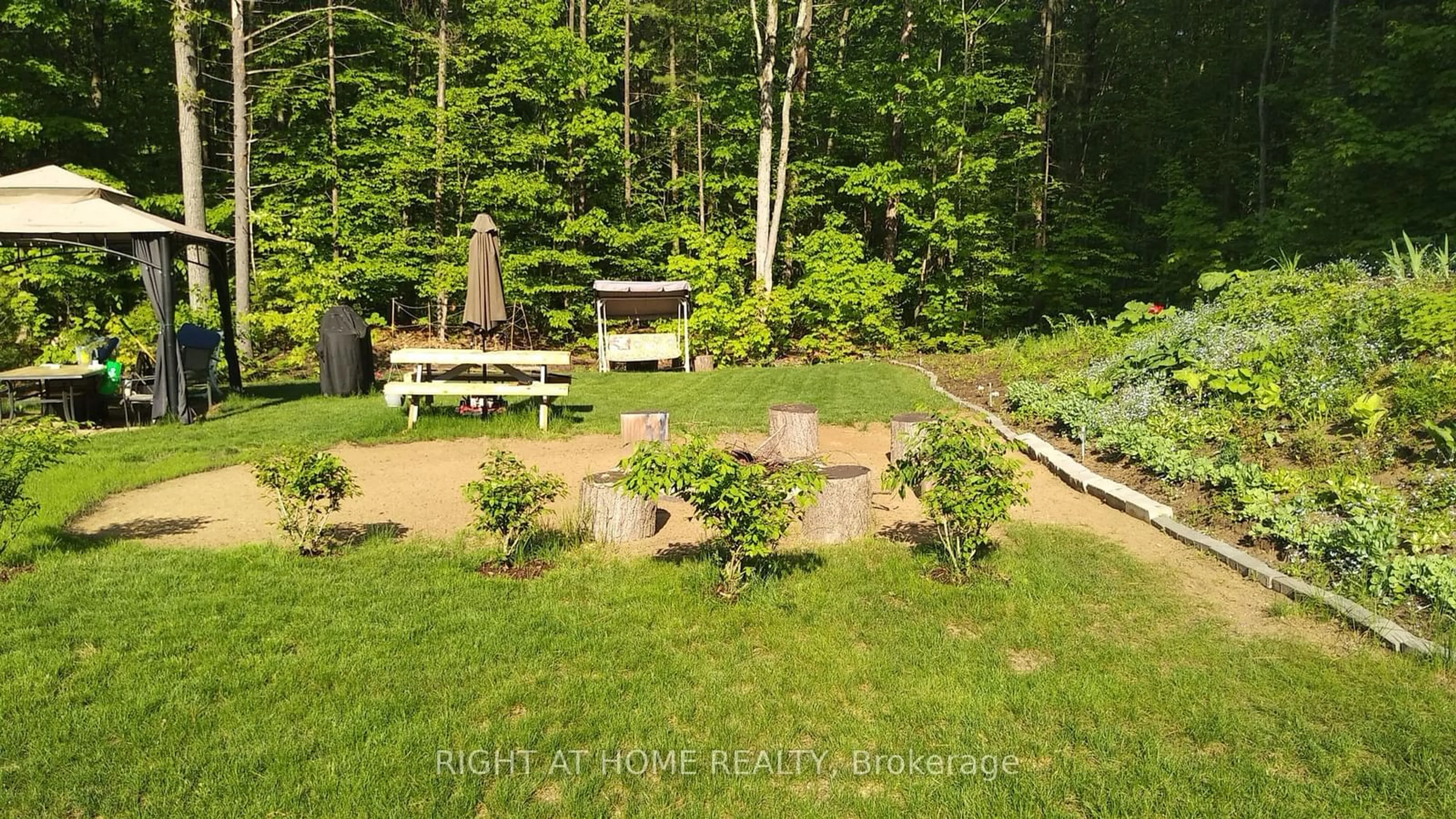 A pic from outside/outdoor area/front of a property/back of a property/a pic from drone, forest/trees view for 37 Moreau Pkwy, Tiny Ontario L9M 0H3