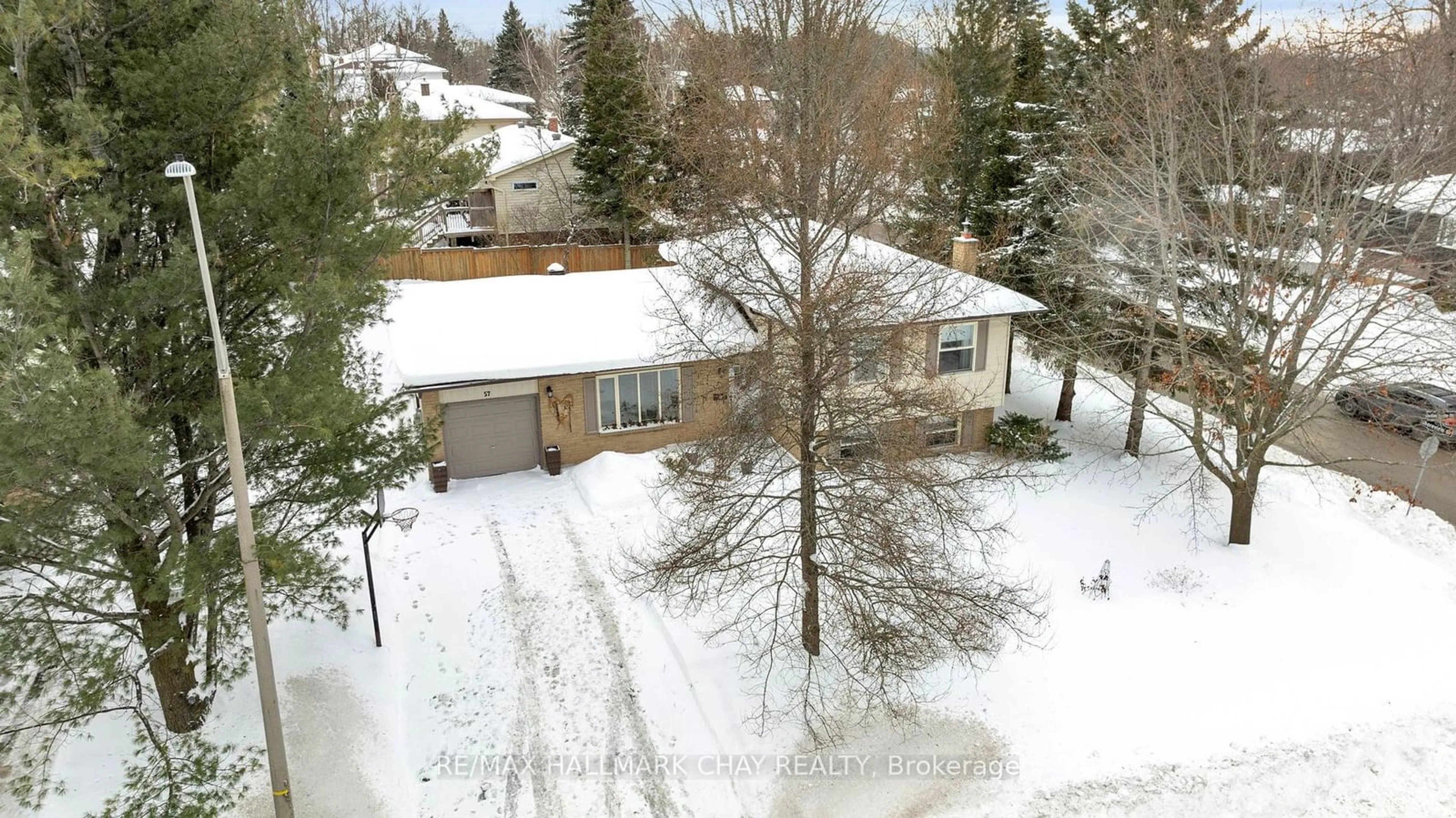 A pic from outside/outdoor area/front of a property/back of a property/a pic from drone, street for 57 Indian Arrow Rd, Barrie Ontario L4M 5P1