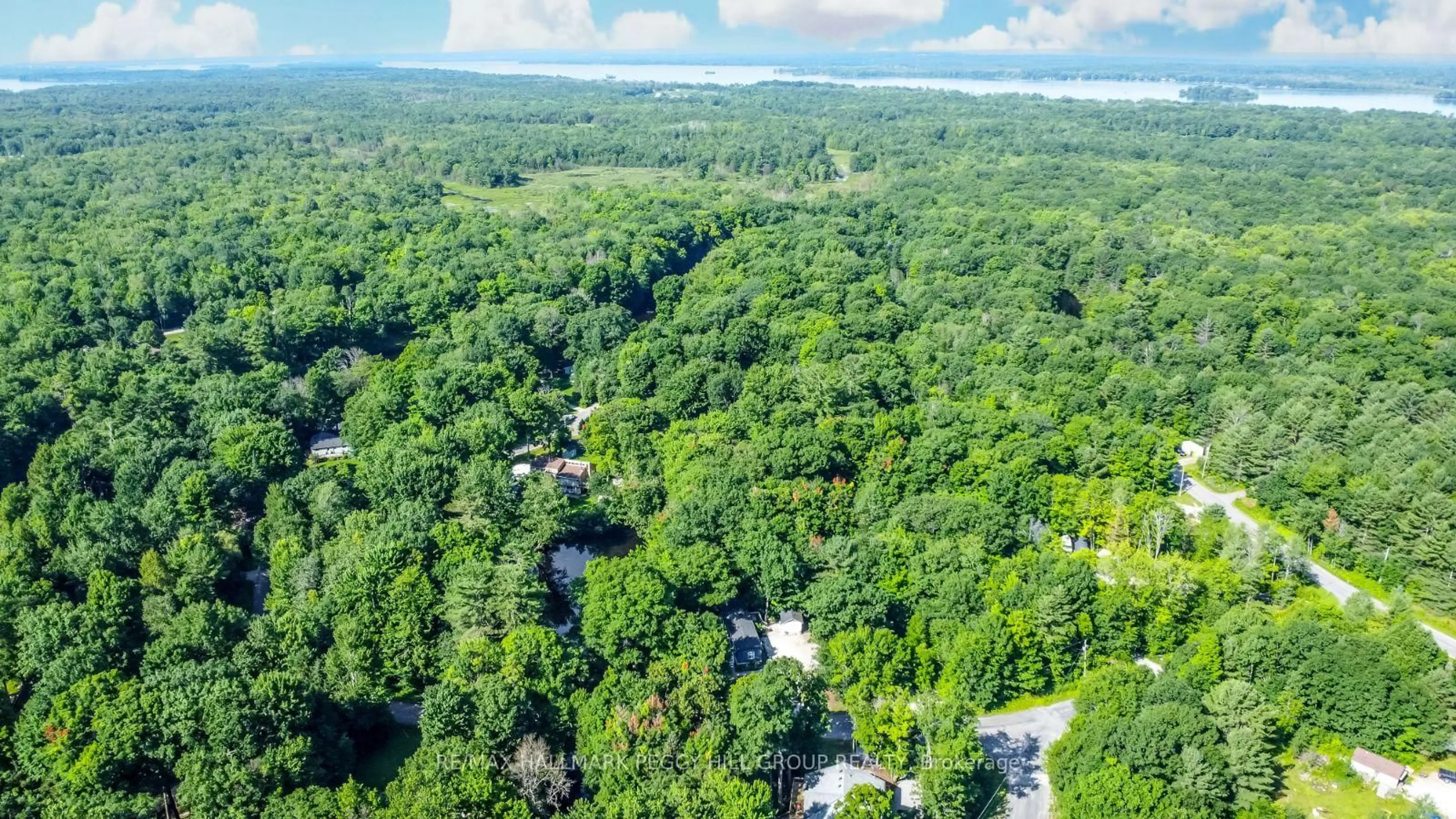 A pic from outside/outdoor area/front of a property/back of a property/a pic from drone, forest/trees view for 7498 Island Cres, Ramara Ontario L0K 2B0