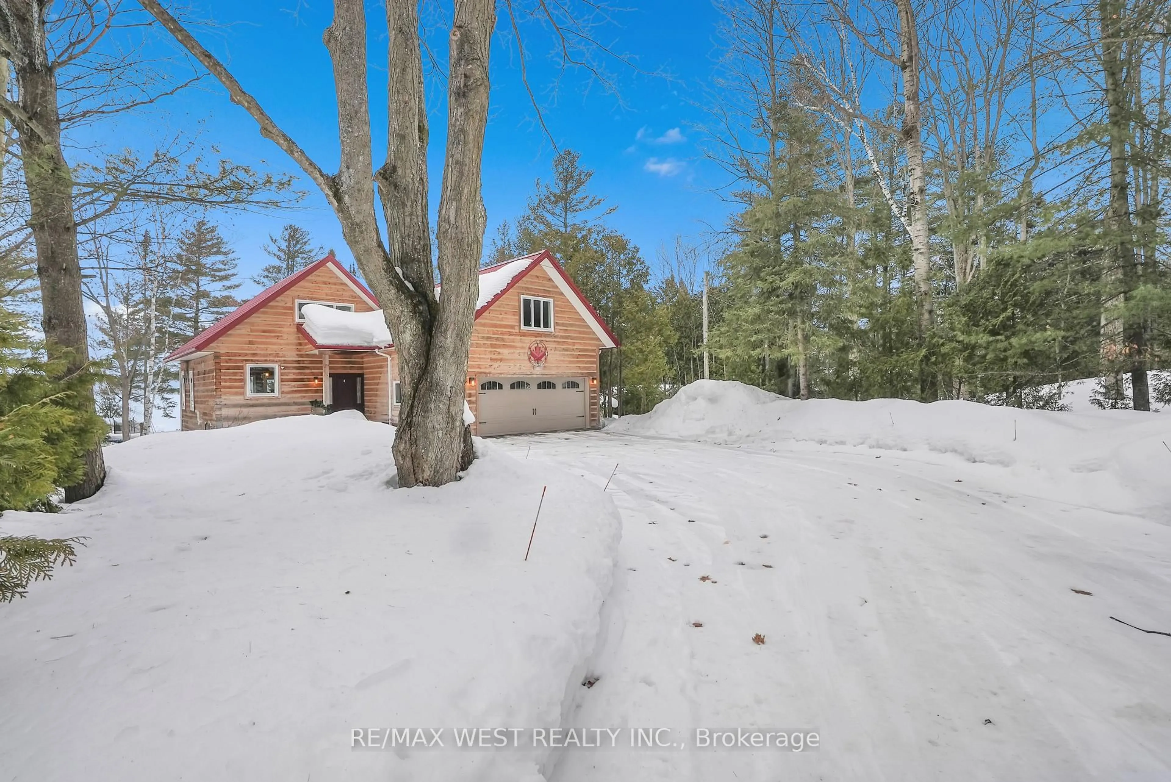 A pic from outside/outdoor area/front of a property/back of a property/a pic from drone, forest/trees view for 2987 Marshall Rd, Springwater Ontario L0L 1P0