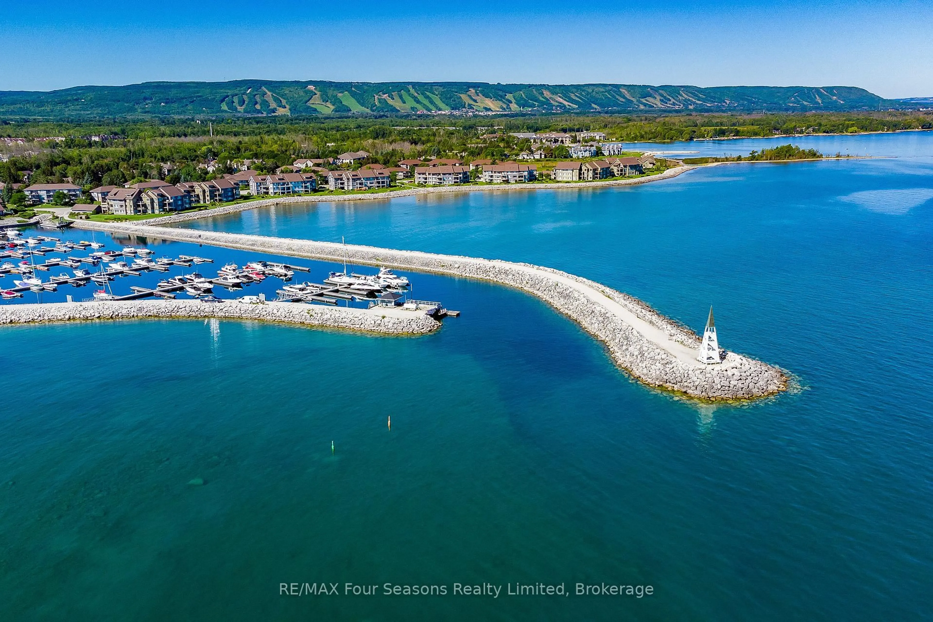 A pic from outside/outdoor area/front of a property/back of a property/a pic from drone, water/lake/river/ocean view for 750 Johnston Park Ave #2012, Collingwood Ontario L9Y 5C7