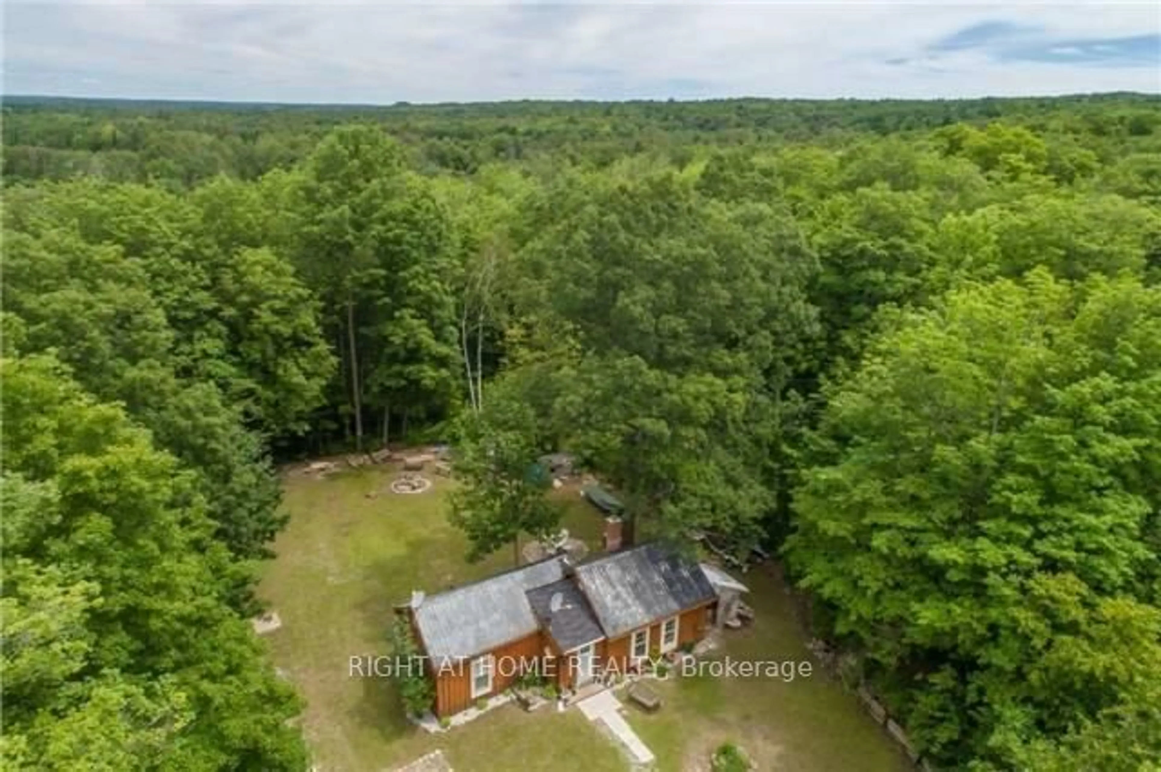 A pic from outside/outdoor area/front of a property/back of a property/a pic from drone, forest/trees view for 10551 HWY 12 Rd, Oro-Medonte Ontario L0K 1E0