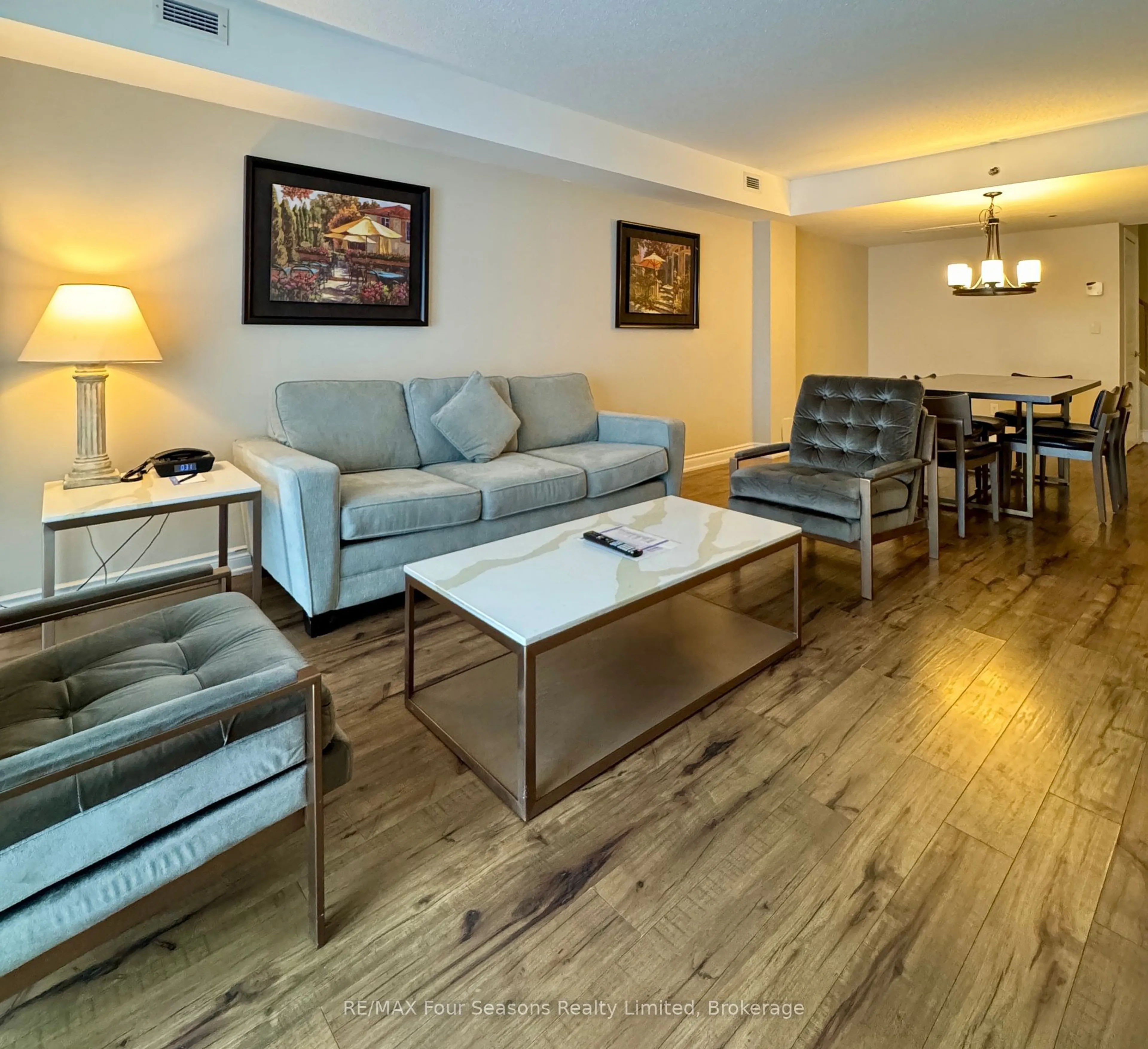 Living room with furniture, wood/laminate floor for 9 Harbour St #2307, Collingwood Ontario L9Y 5C5