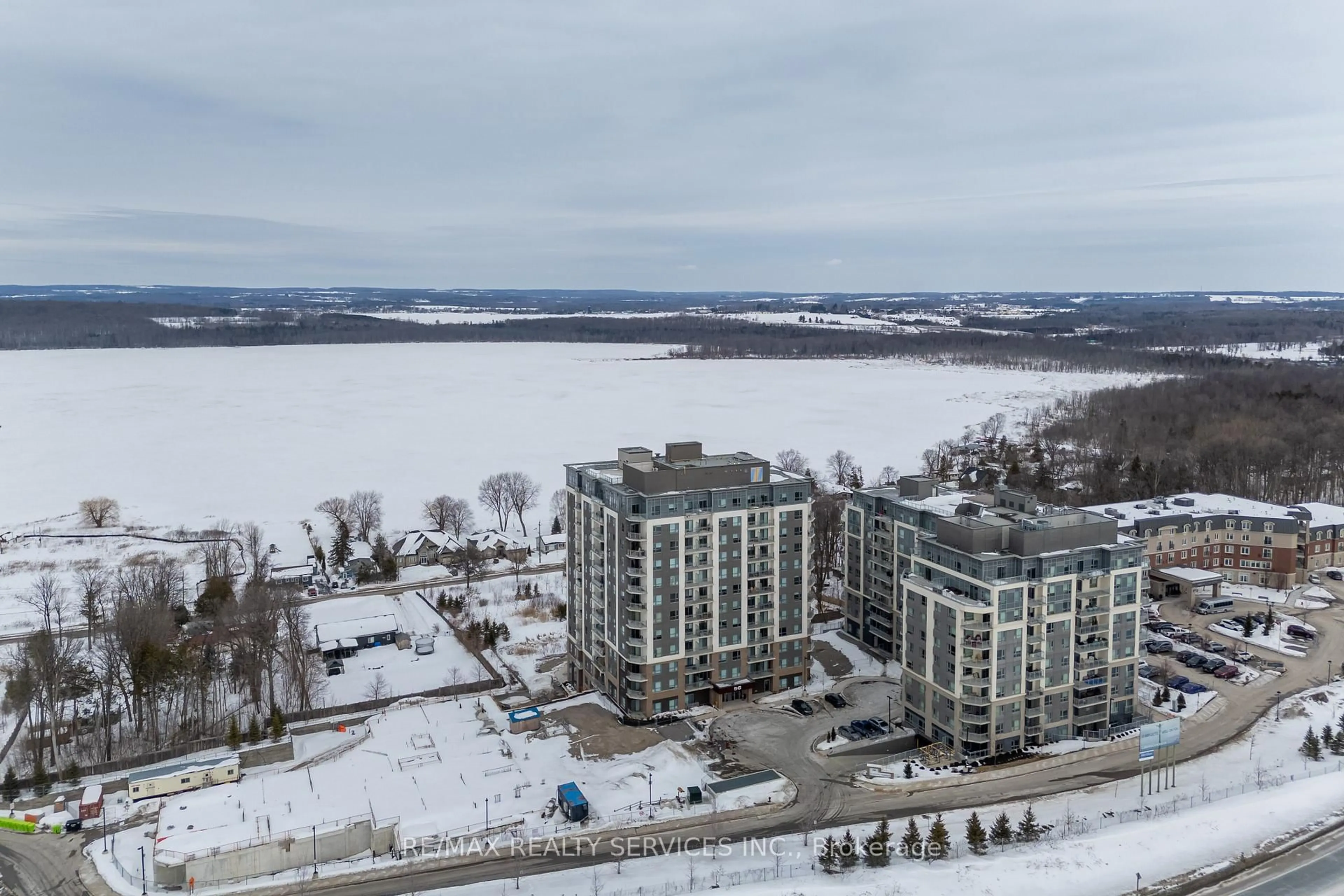 A pic from outside/outdoor area/front of a property/back of a property/a pic from drone, water/lake/river/ocean view for 56 Lakeside Terr #108, Barrie Ontario L4M 0L5