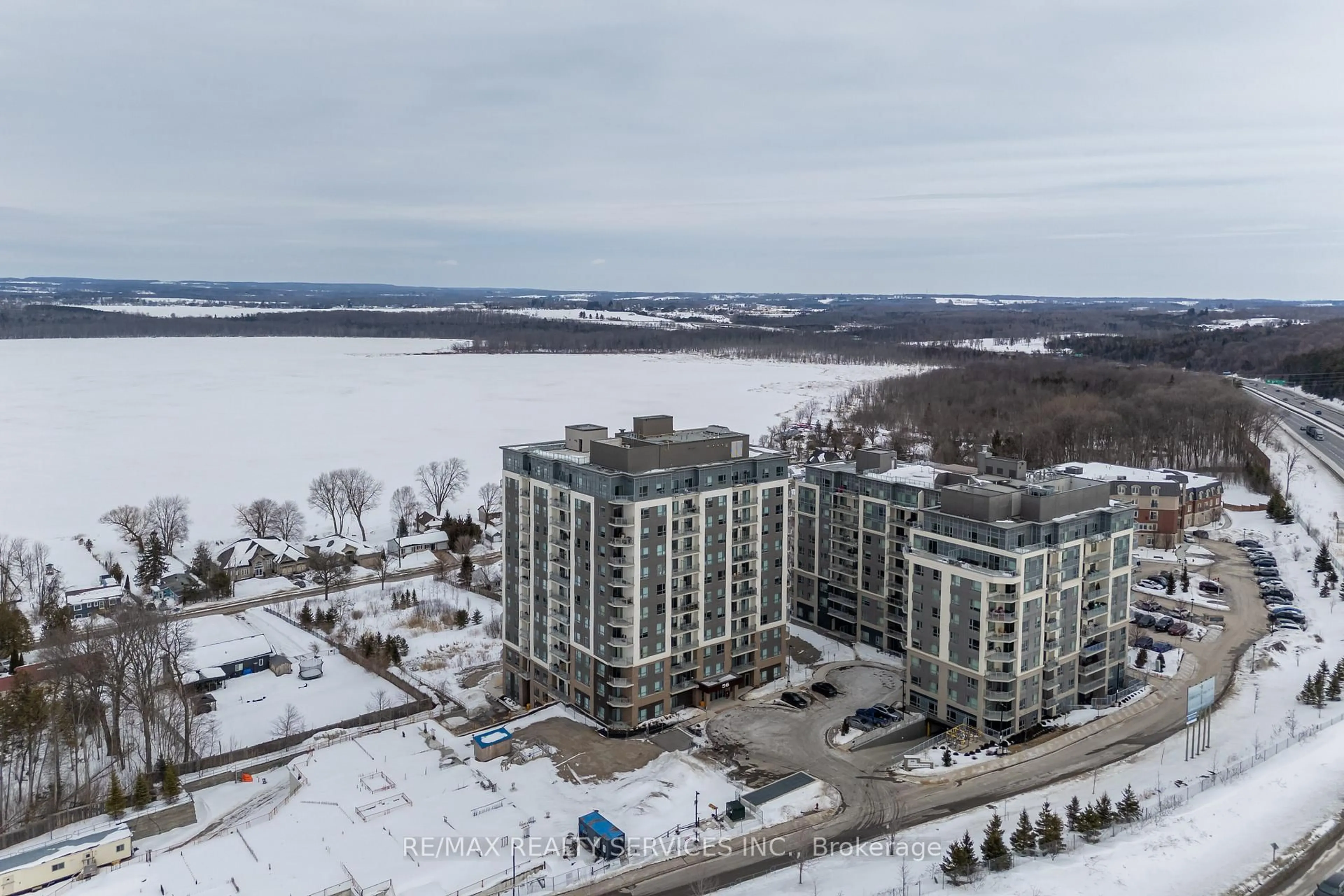 A pic from outside/outdoor area/front of a property/back of a property/a pic from drone, water/lake/river/ocean view for 56 Lakeside Terr #108, Barrie Ontario L4M 0L5