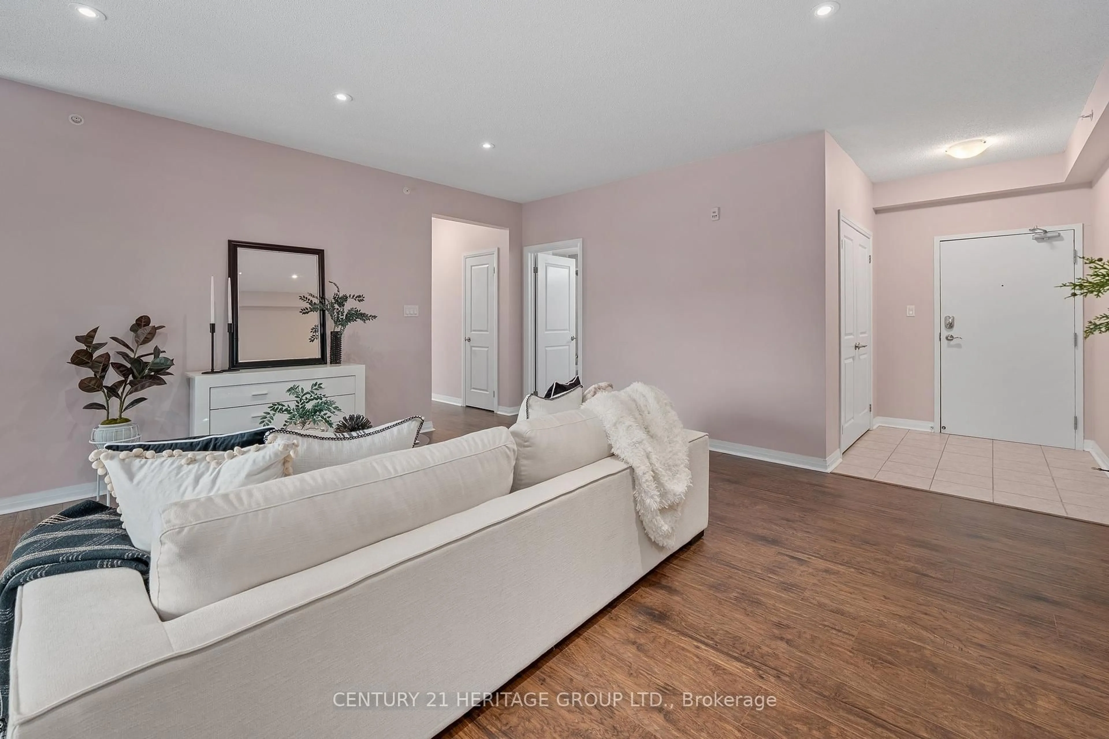 Living room with furniture, wood/laminate floor for 306 Essa Rd, Barrie Ontario L4N 9C5