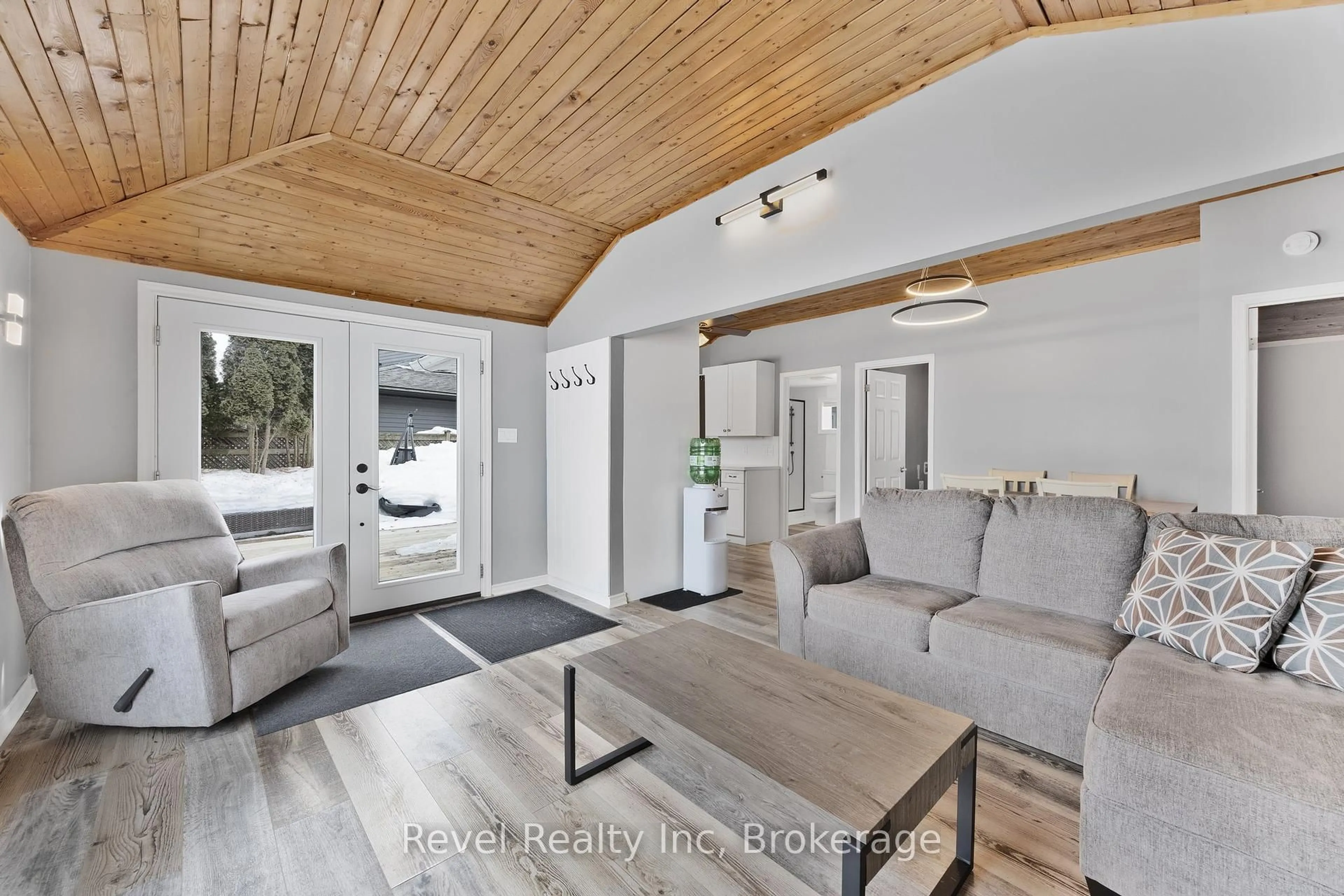 Living room with furniture, wood/laminate floor for 97 Maskinonge Rd, Tay Ontario L0K 2A0
