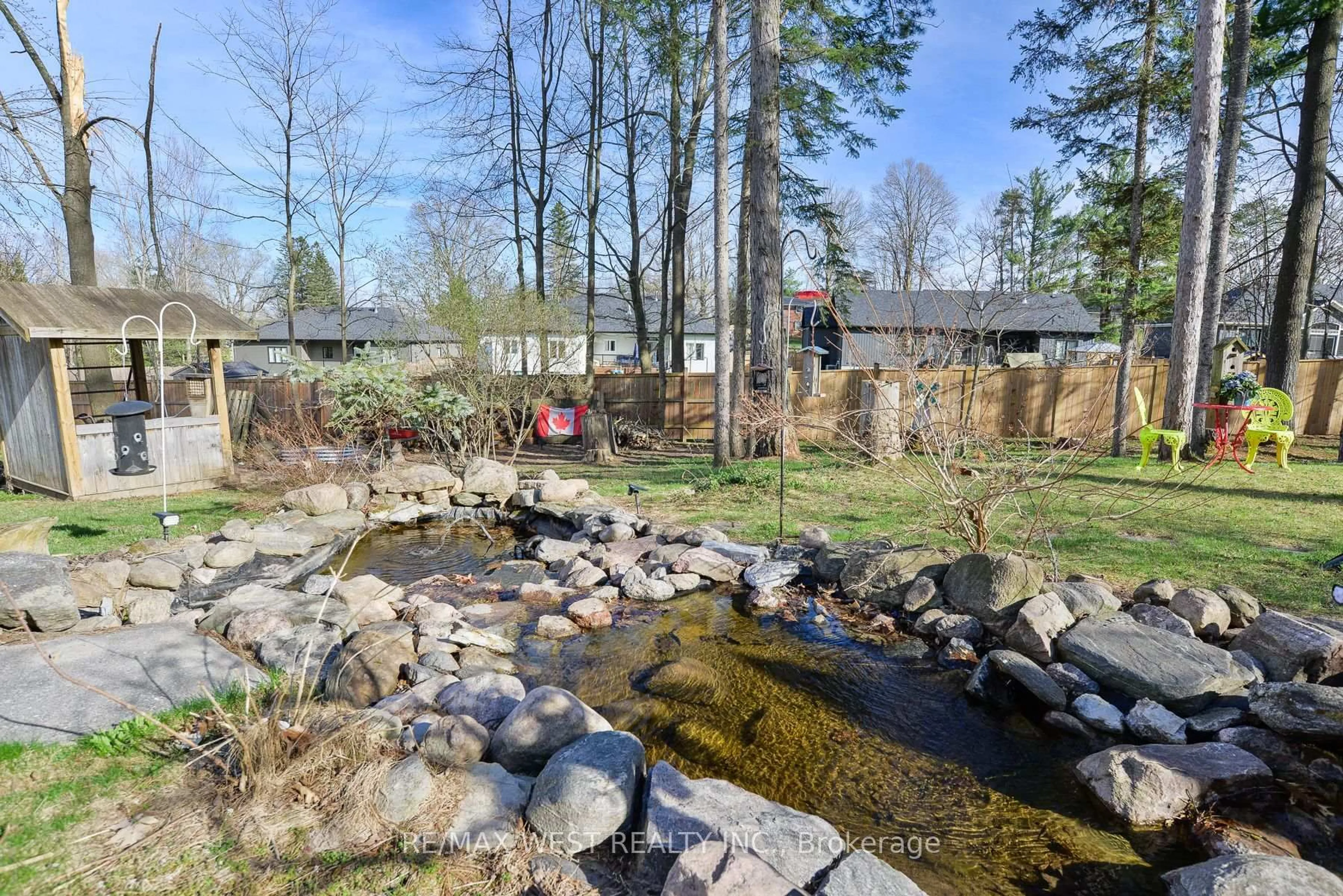 A pic from outside/outdoor area/front of a property/back of a property/a pic from drone, water/lake/river/ocean view for 13 Albert St, Springwater Ontario L0L 1V0