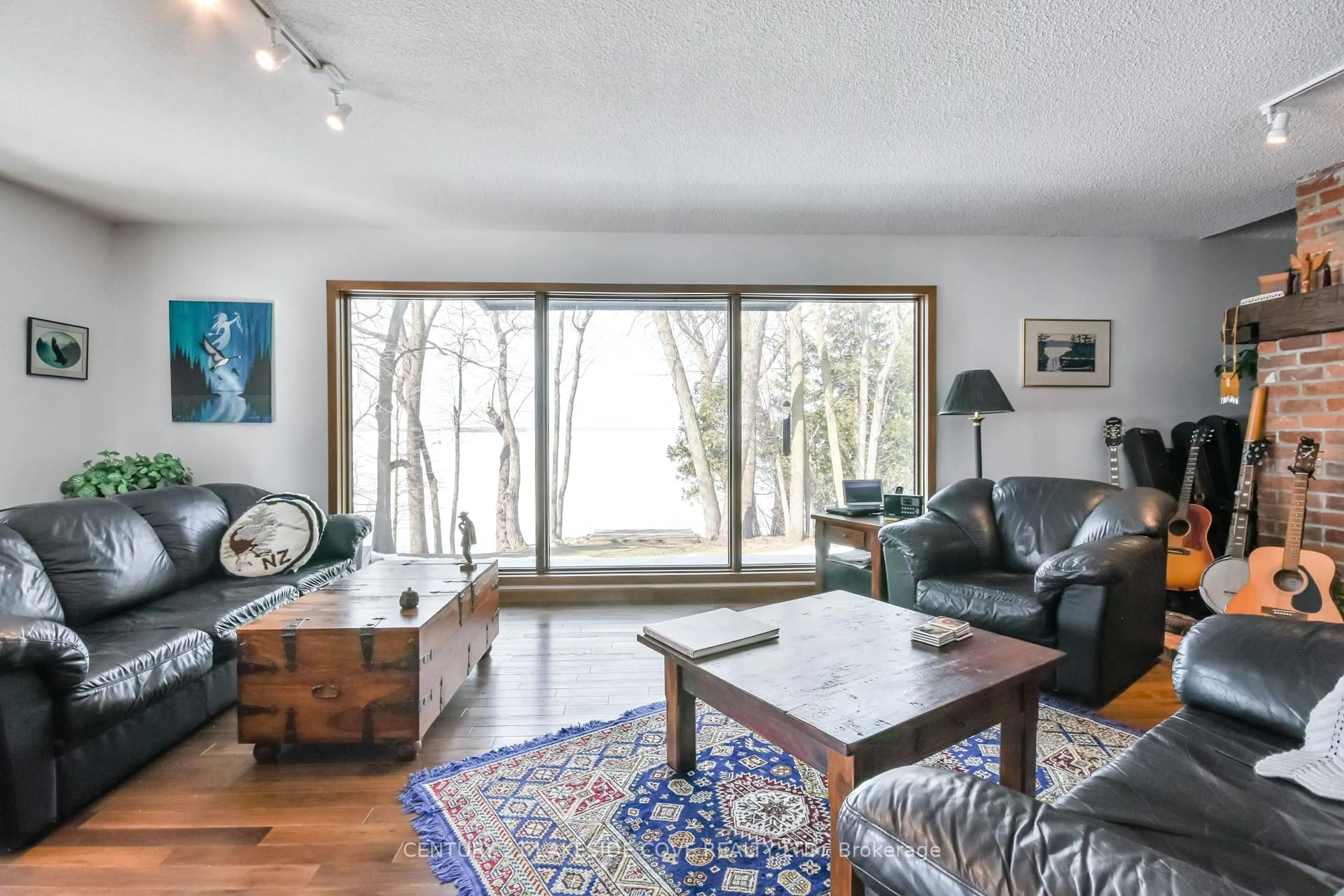 Living room with furniture, wood/laminate floor for 42 Thicketwood Pl, Ramara Ontario L0K 1B0