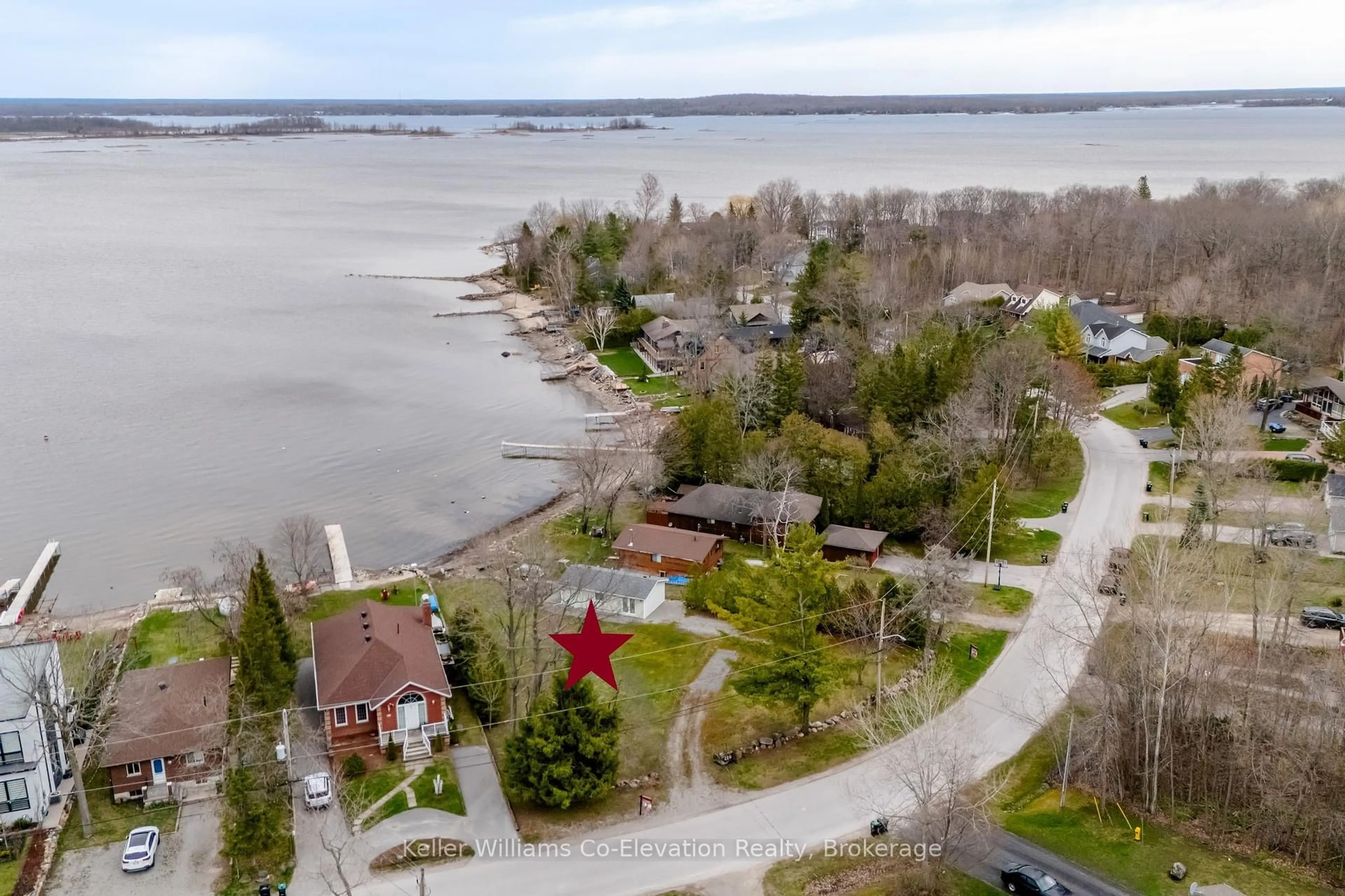 A pic from outside/outdoor area/front of a property/back of a property/a pic from drone, water/lake/river/ocean view for 220 Robin's Point Rd, Tay Ontario L0K 2A0