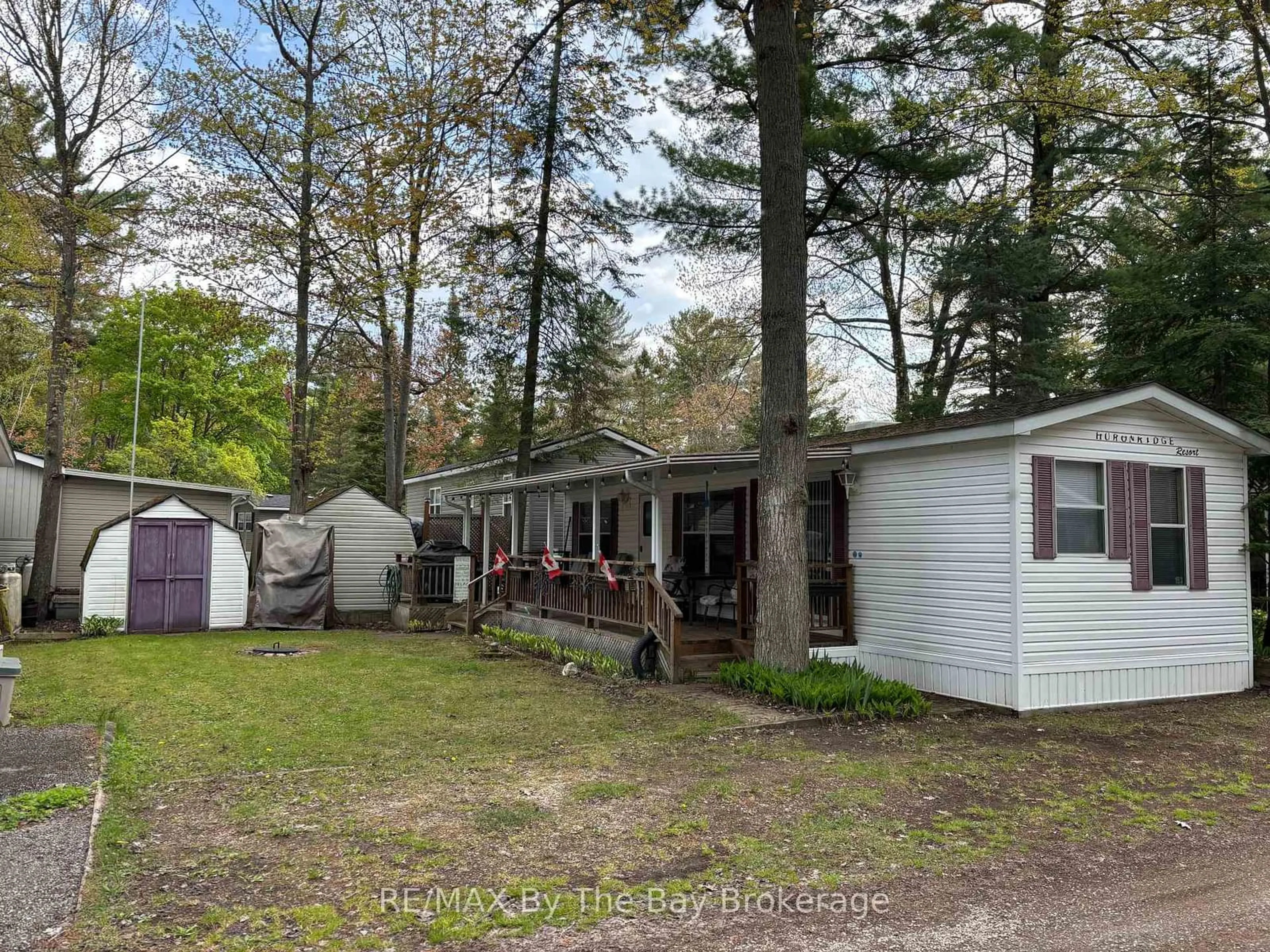 A pic from outside/outdoor area/front of a property/back of a property/a pic from drone, unknown for 85 Theme Park Dr #153, Wasaga Beach Ontario L9Z 1X7