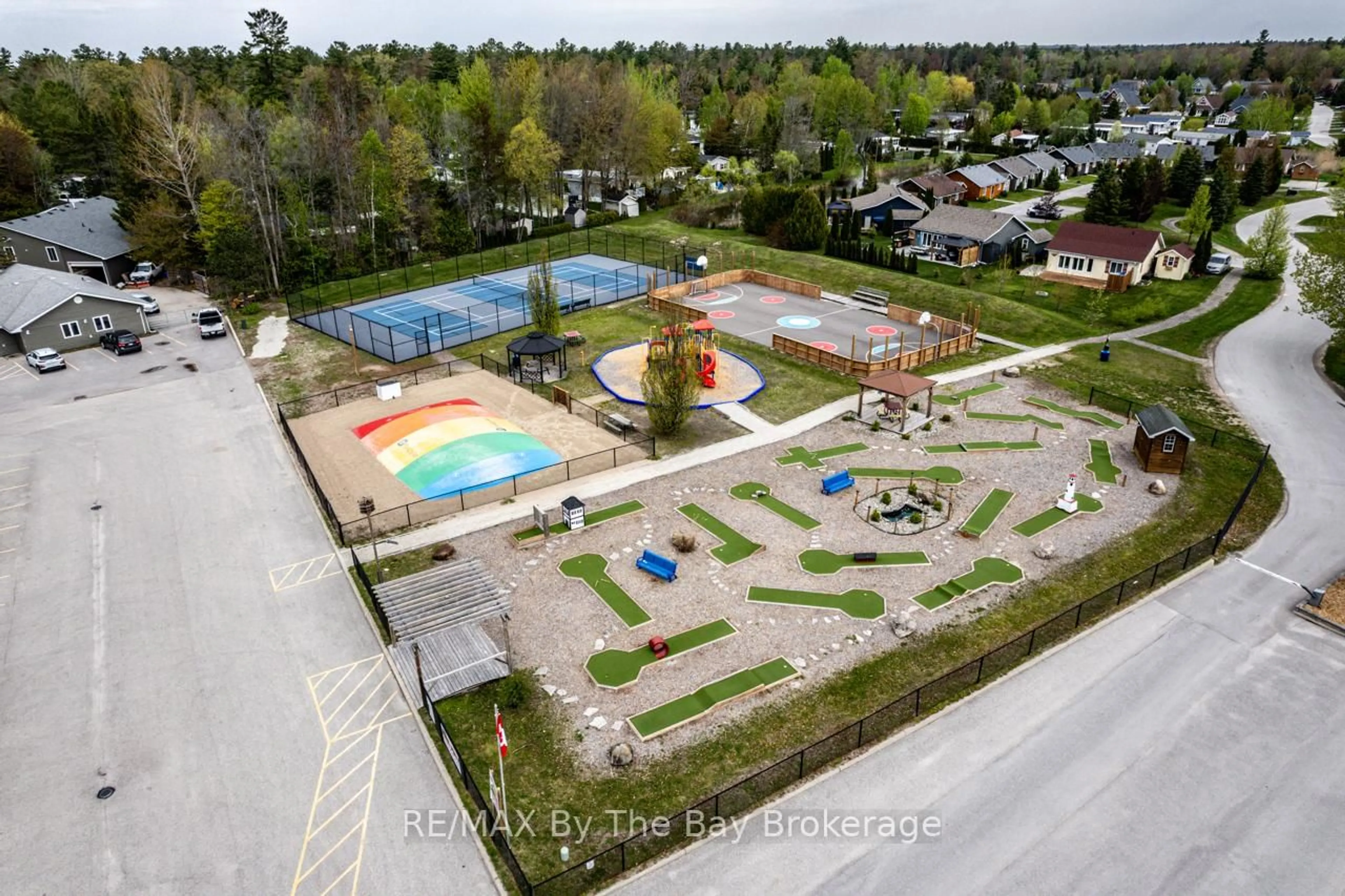 A pic from outside/outdoor area/front of a property/back of a property/a pic from drone, street for 85 Theme Park Dr #153, Wasaga Beach Ontario L9Z 1X7